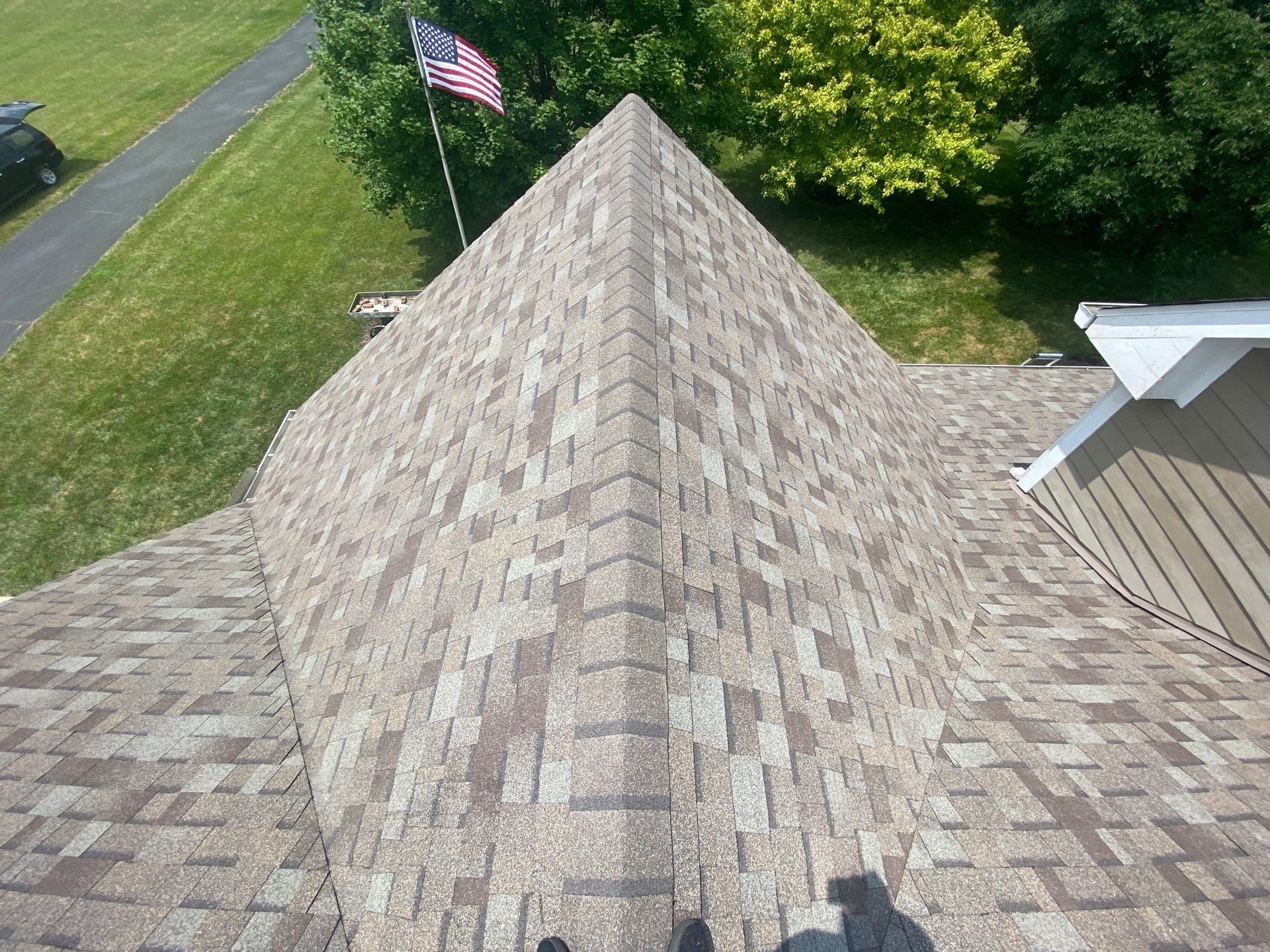 Finished hip with new cap shingles running down to the eave, Yellow Springs, Ohio.