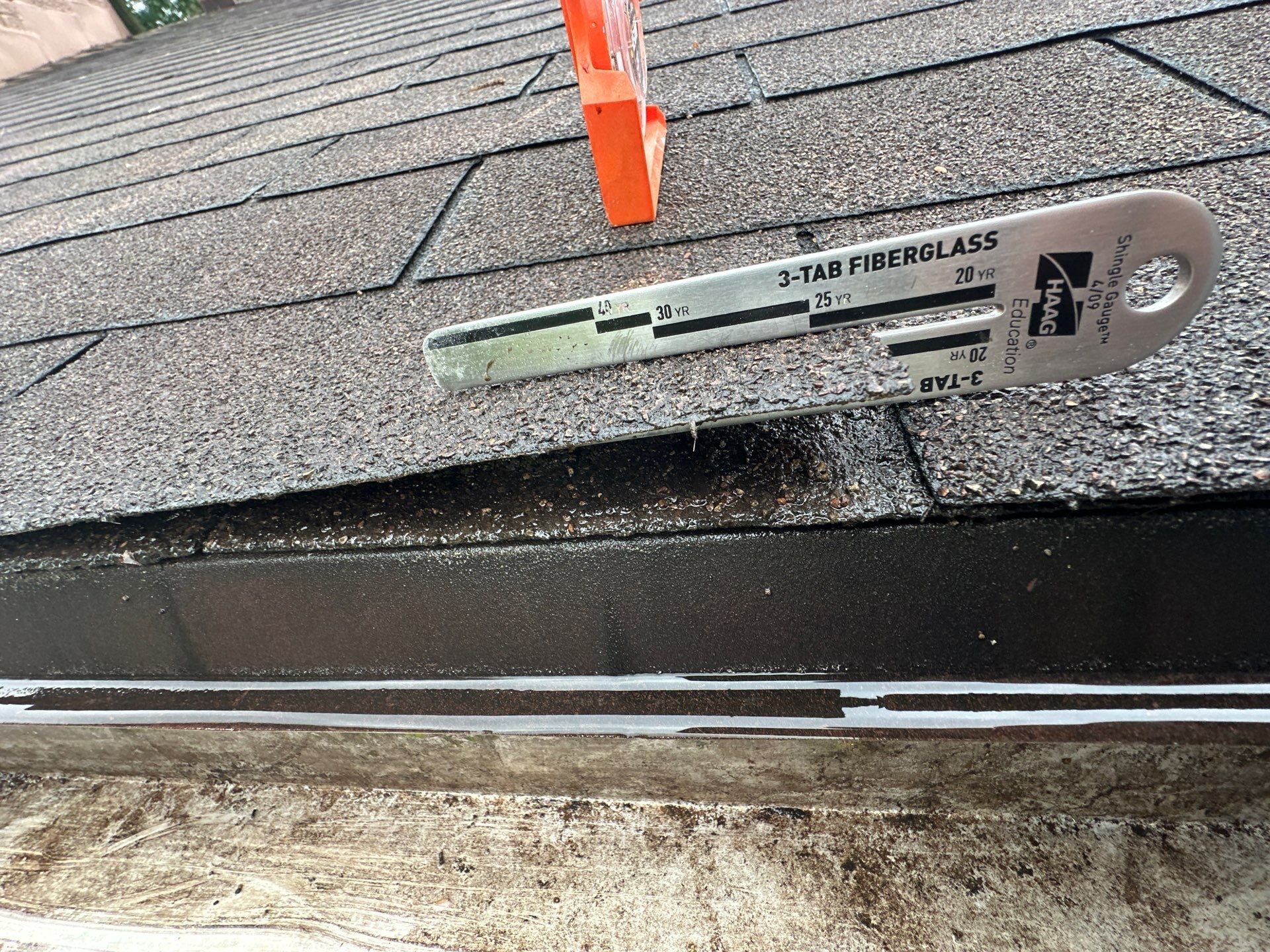 Shingle gauge confirming the old roof was three tab fiberglass shingles, Beavercreek, Ohio.