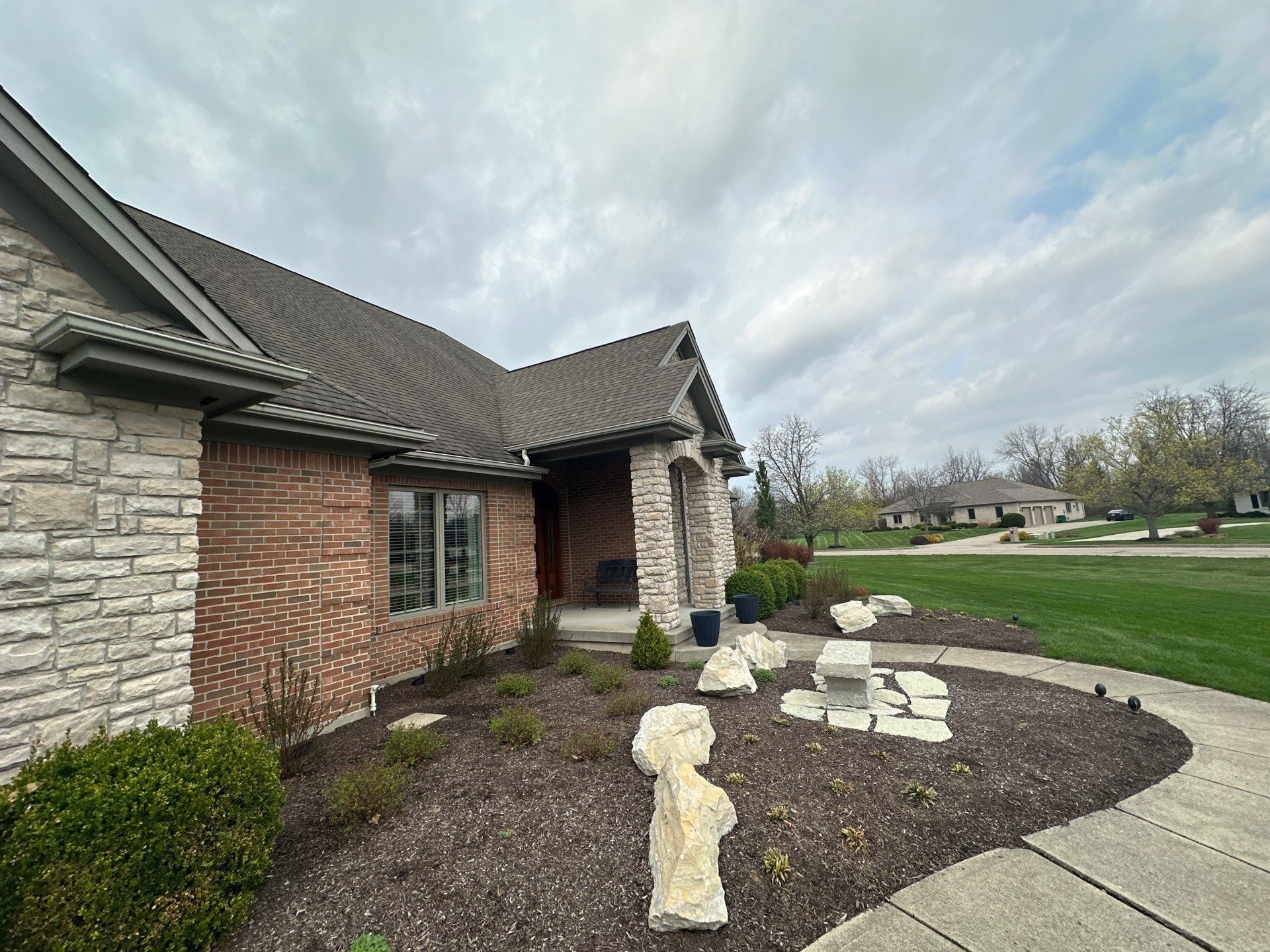 Front doorway and stone planting bed