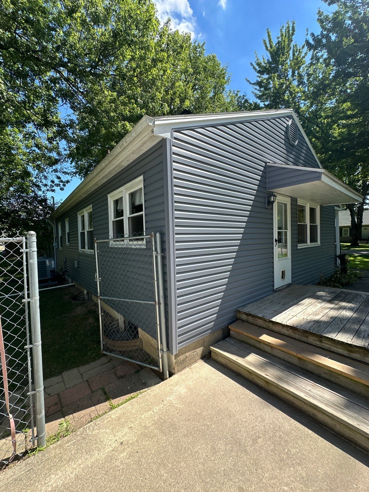 New siding by the back steps and the chain link gate, Beavercreek, Ohio.