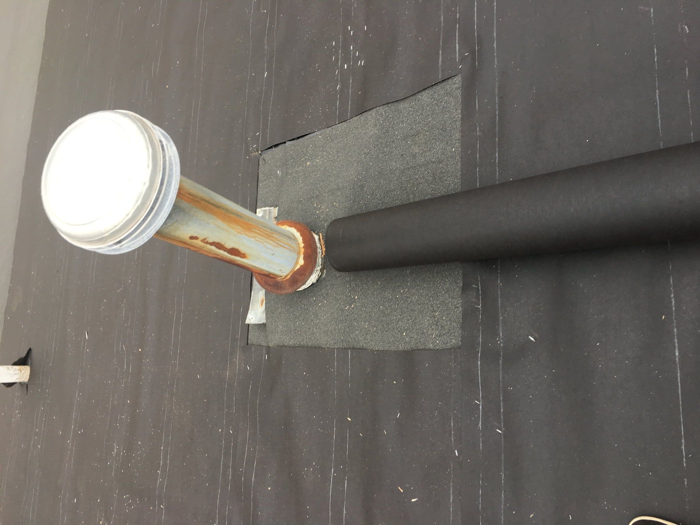 Ice and water shield wrapped around the furnace vent pipe, Fairborn, Ohio.