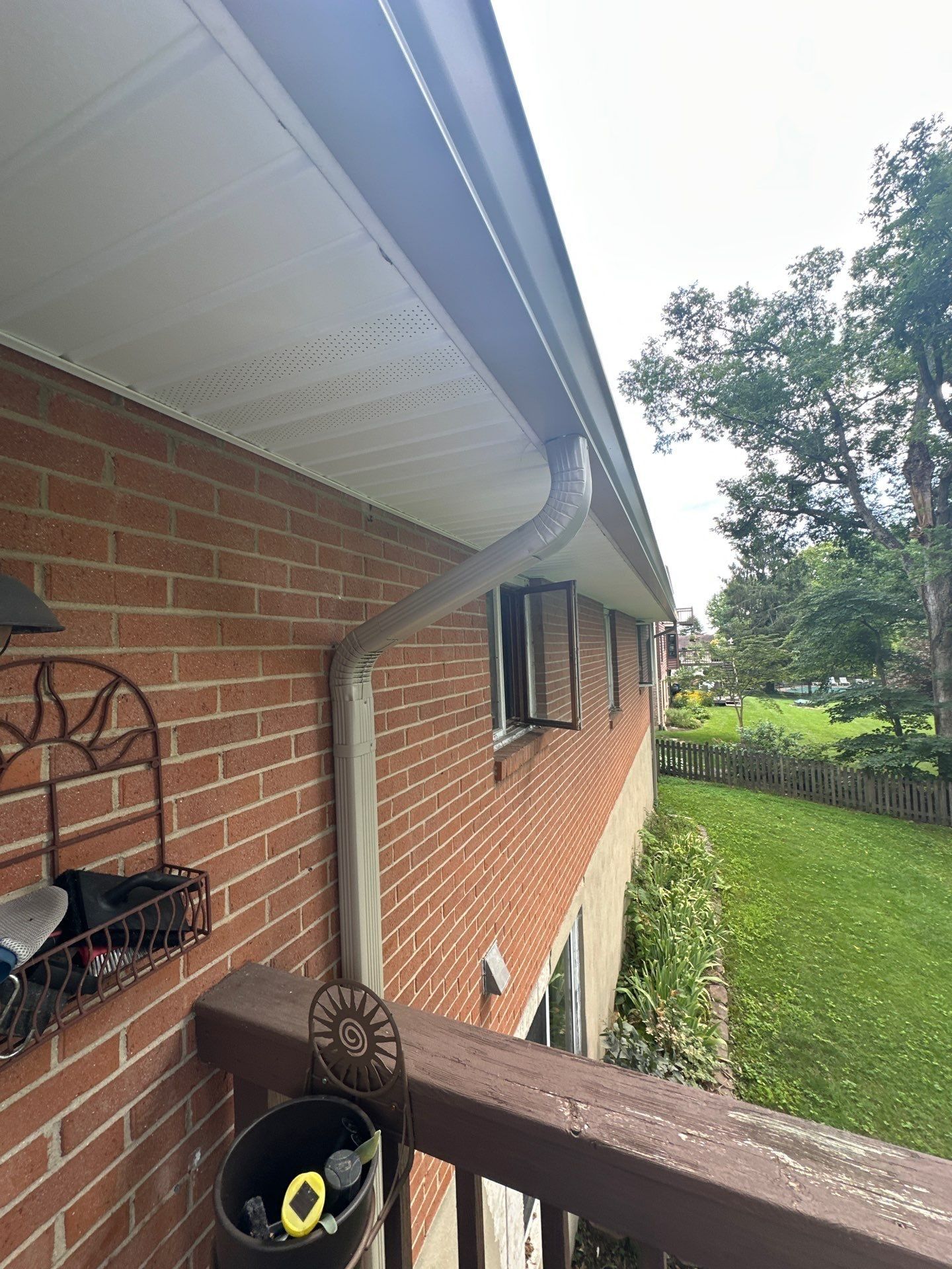 White fascia, soffit and downspout