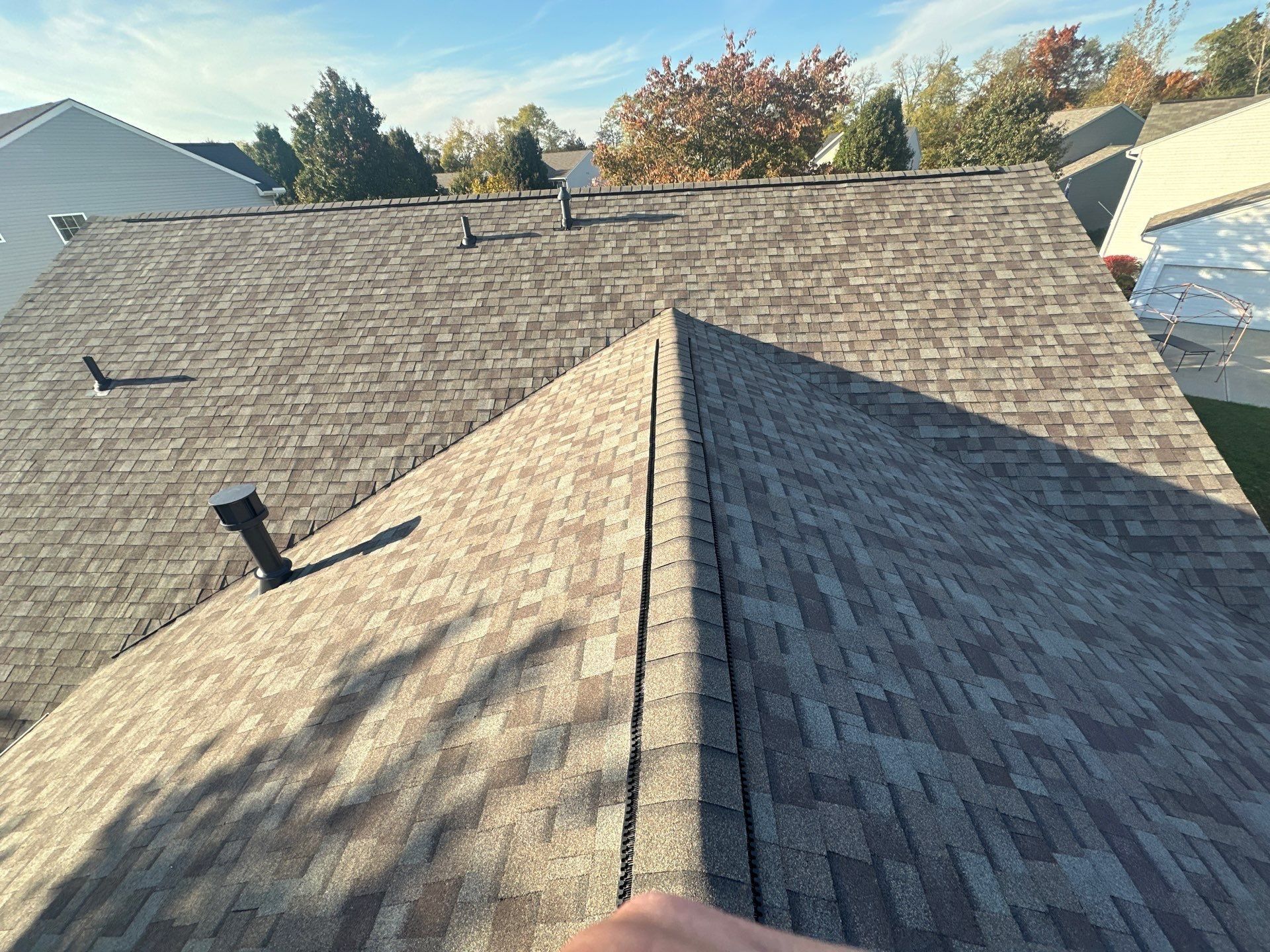 Two finished ridges meeting, with new roof vents, Beavercreek, Ohio.