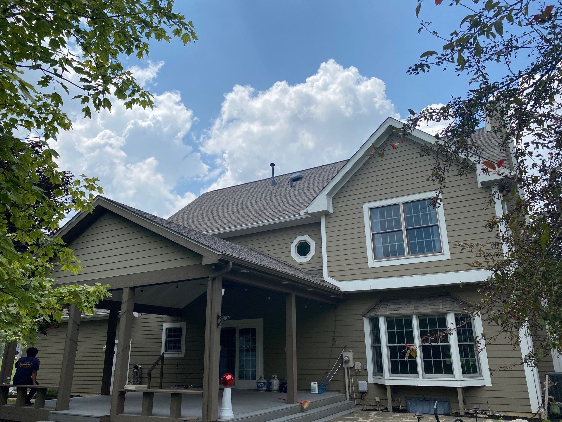 Rear of the home with the new roof over the covered patio, Yellow Springs, Ohio.