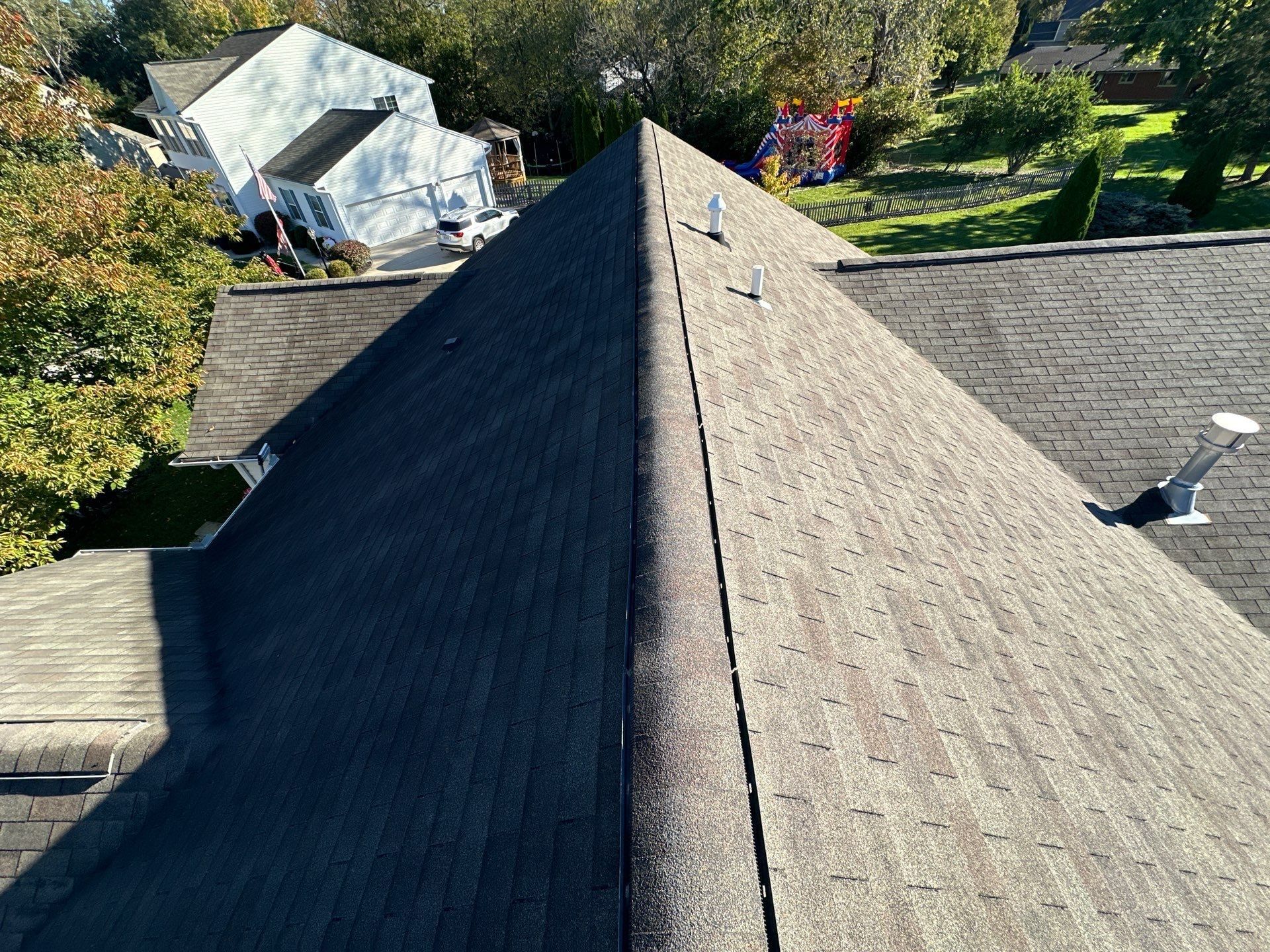 The original shingles along a hip of the old roof, with its roof vents, Beavercreek, Ohio.