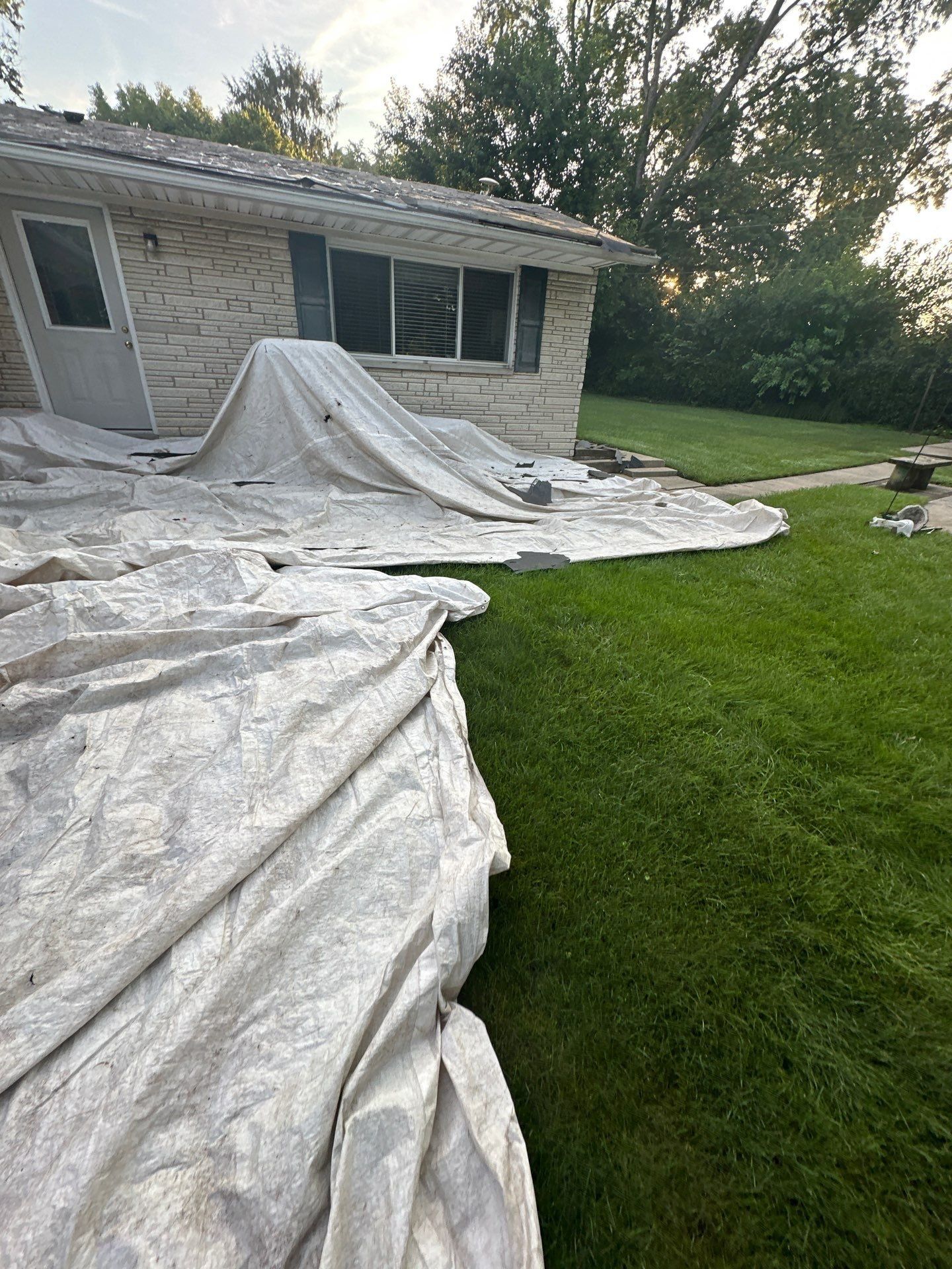 Tarps at the white brick wing
