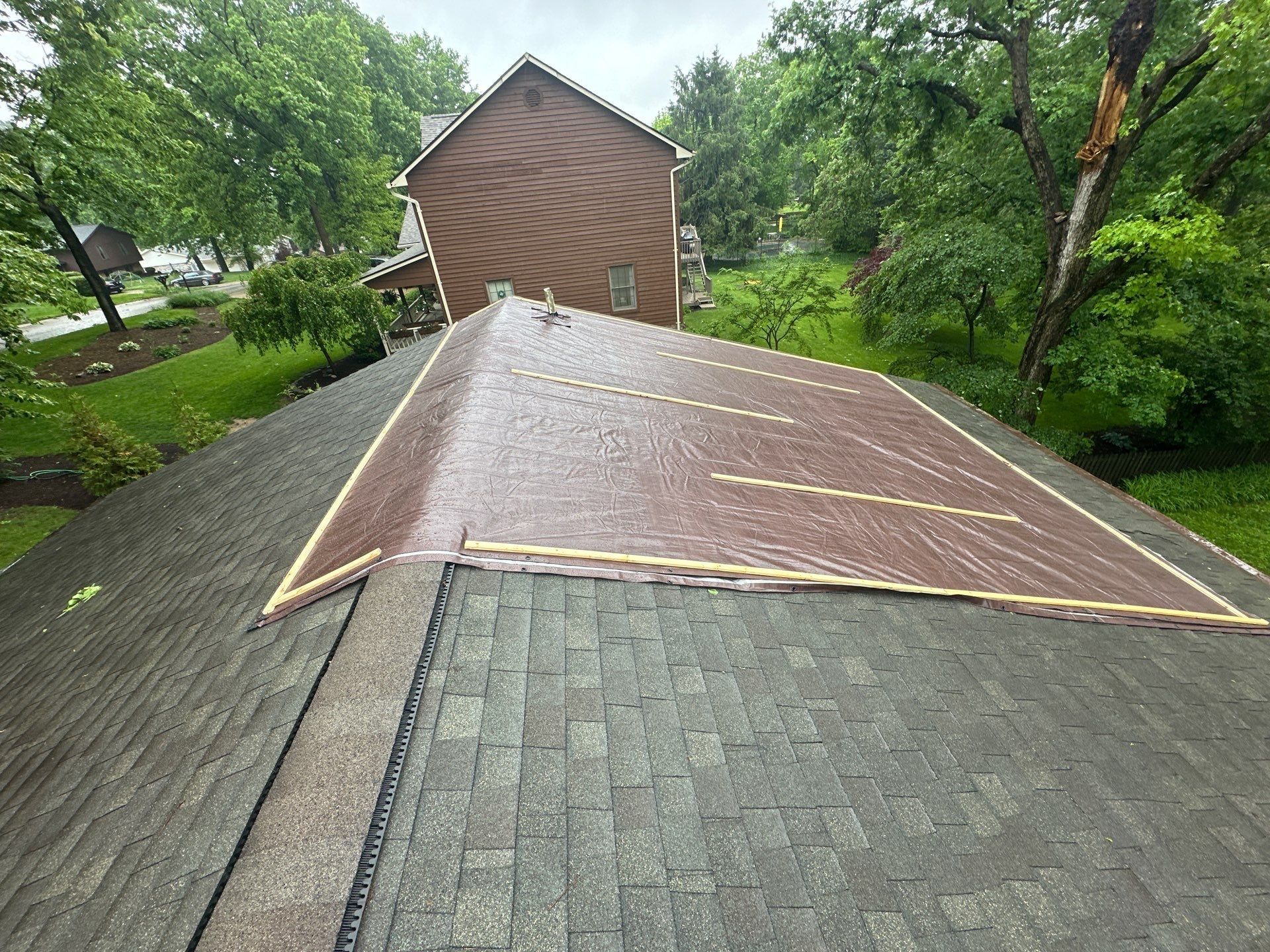 Larger tarp battened over the area