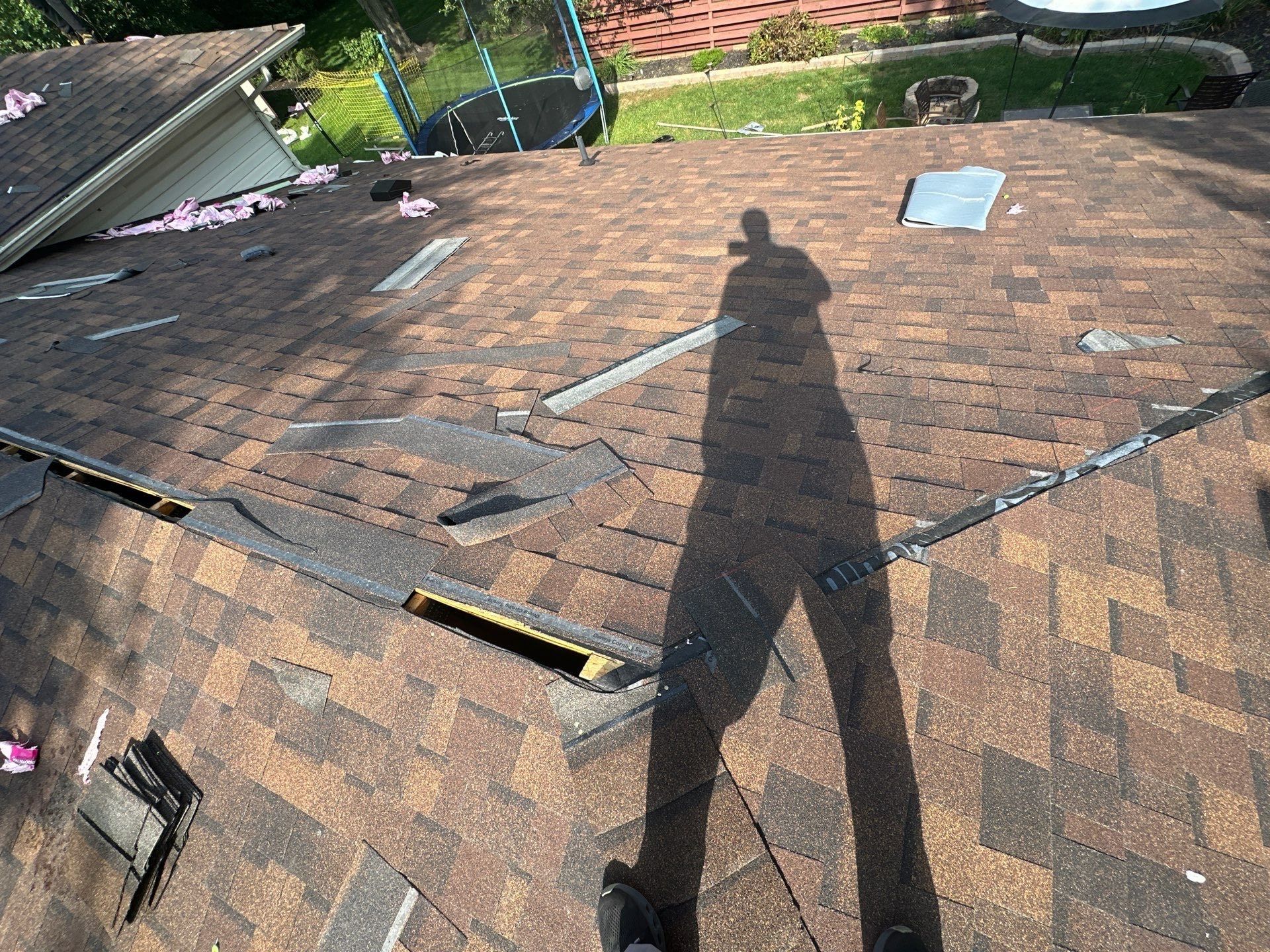 New Duration shingles going on, with flashing pieces laid out on the roof, Dayton, Ohio.