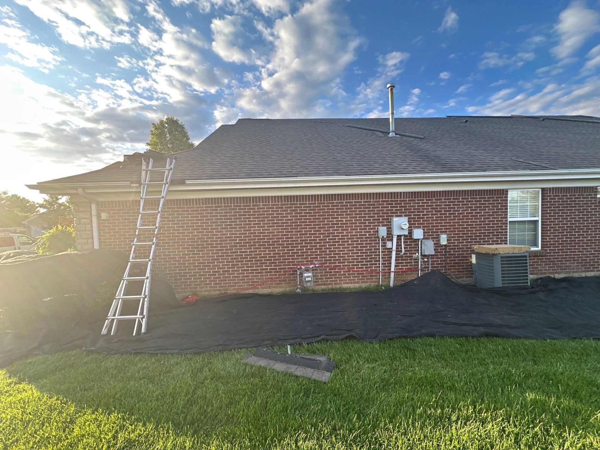 Tarps the length of the rear elevation