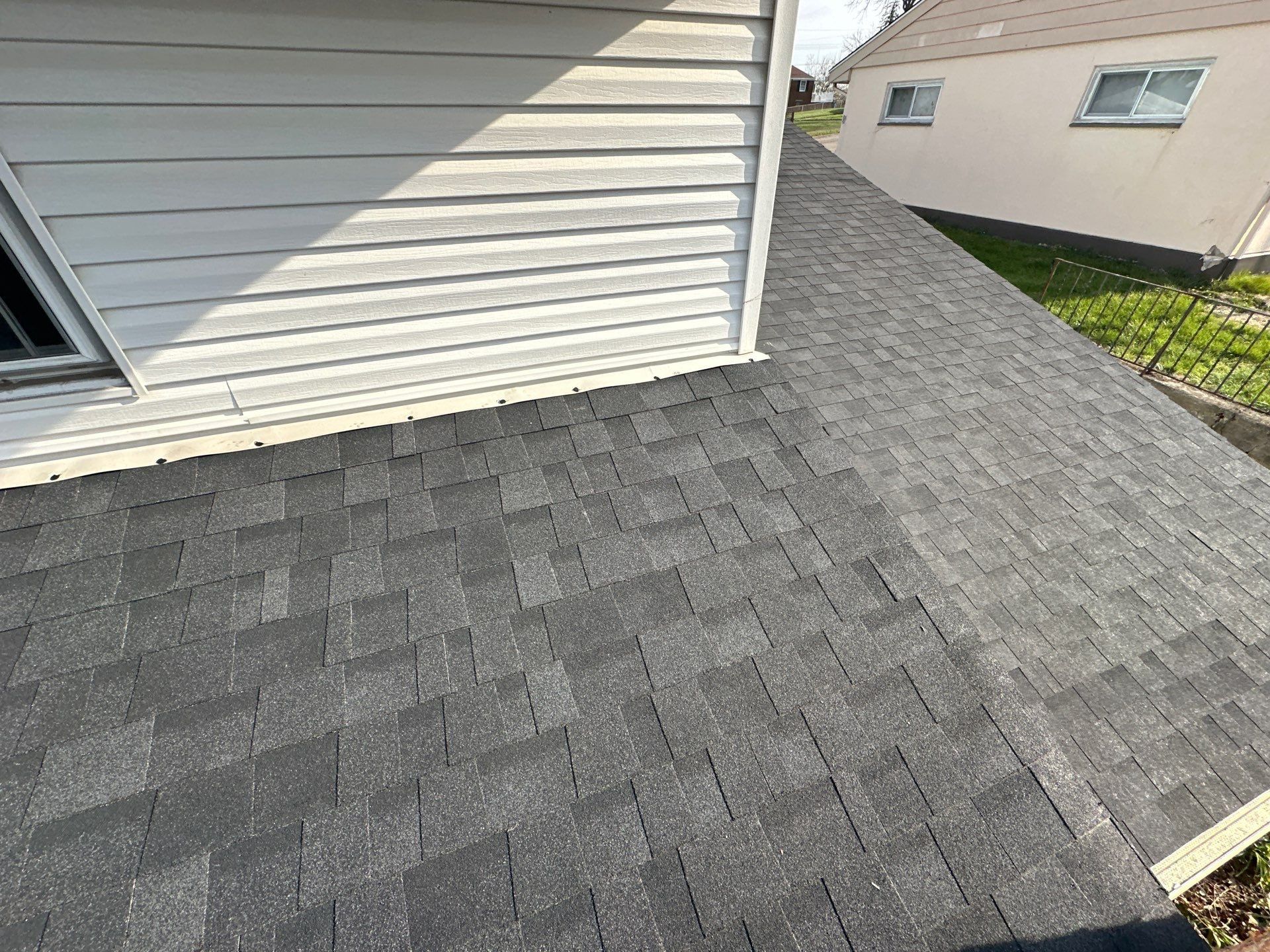 Finished Duration shingles where the roof meets the siding, Dayton, Ohio.