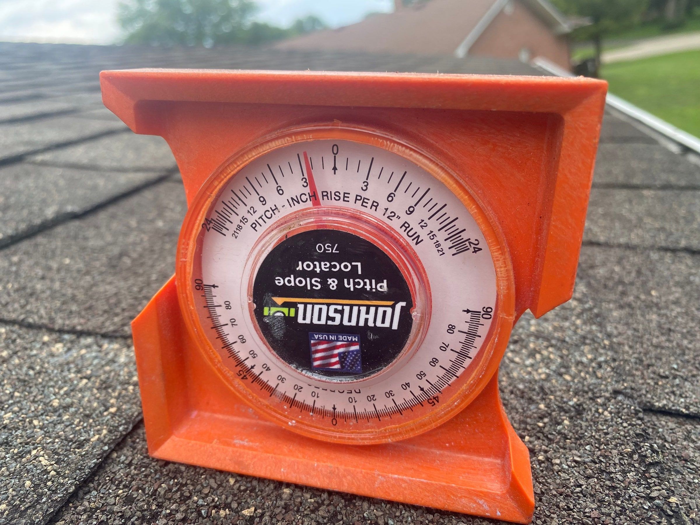 A pitch gauge on the three-tab shingles, Kettering, Ohio.