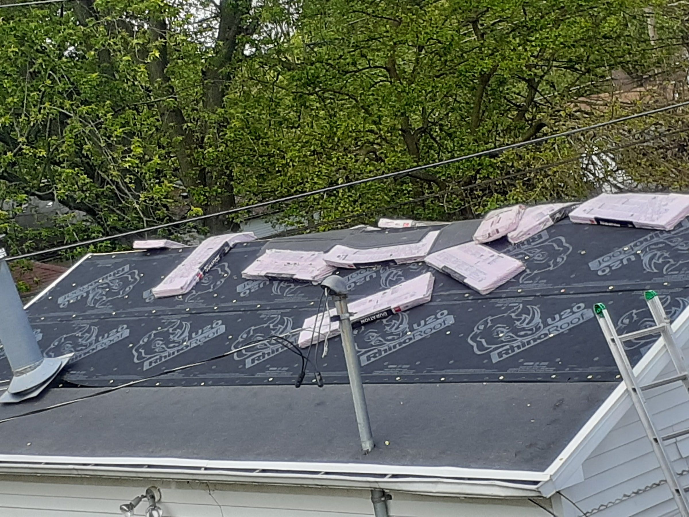 Synthetic underlayment and bundles on the detached garage roof, Huber Heights, Ohio.