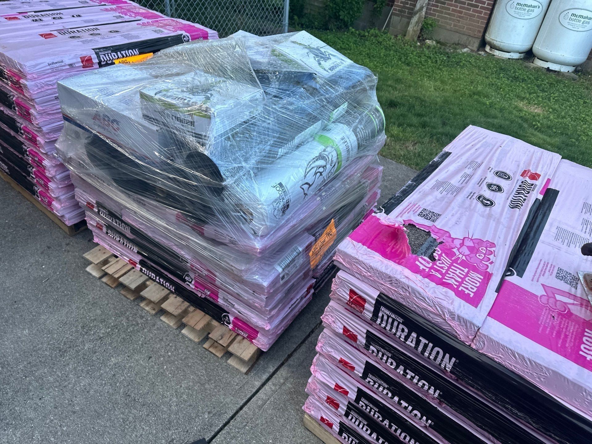 Pallets of Owens Corning Duration shingles beside the house, Beavercreek, Ohio.