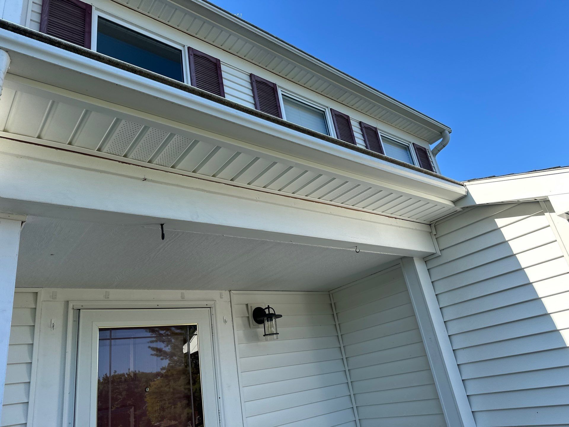 Vented vinyl soffit and white trim above the front door, Bellbrook, Ohio.