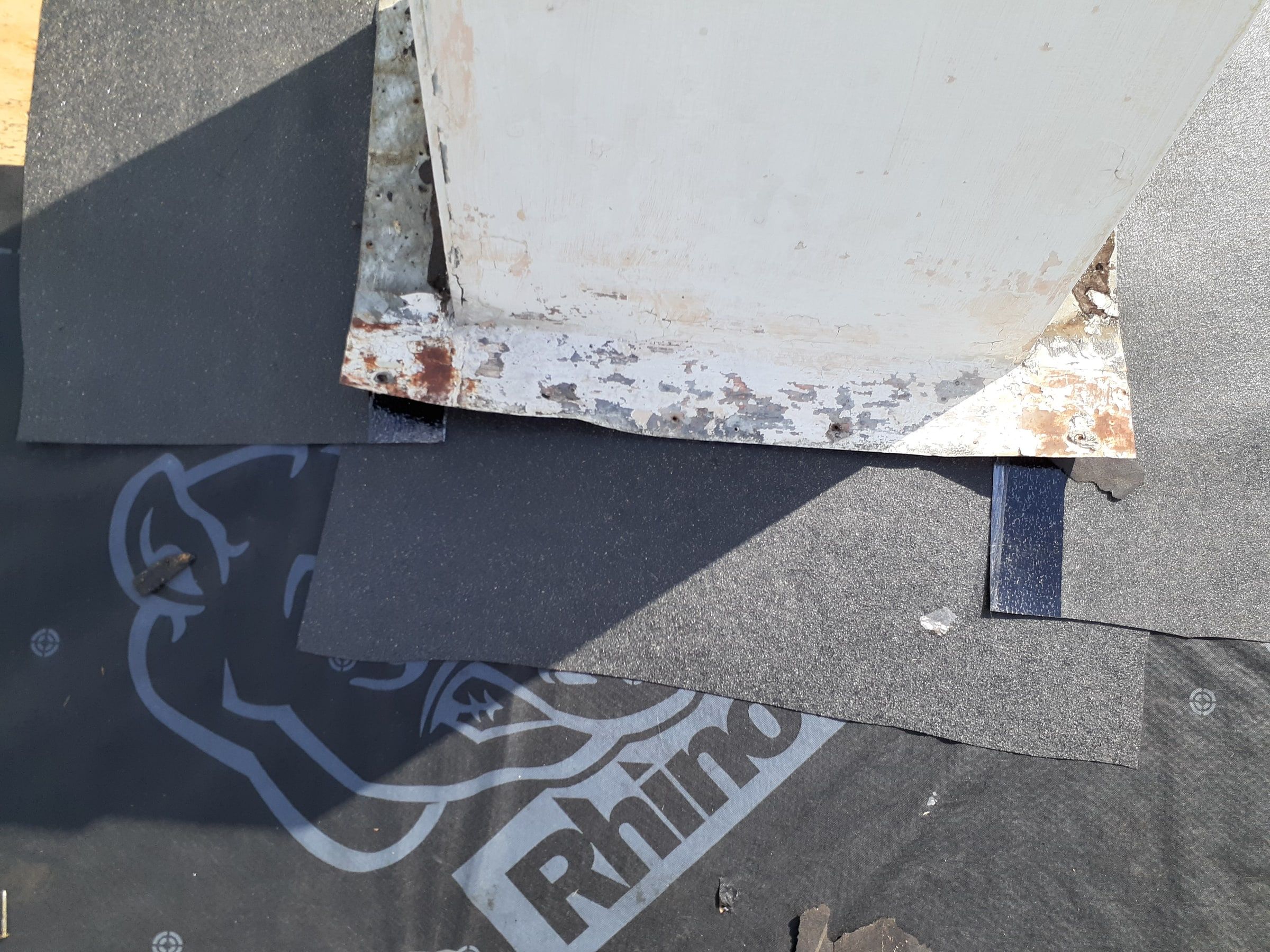 New flashing laid at the base of the chimney over the underlayment, Huber Heights, Ohio.