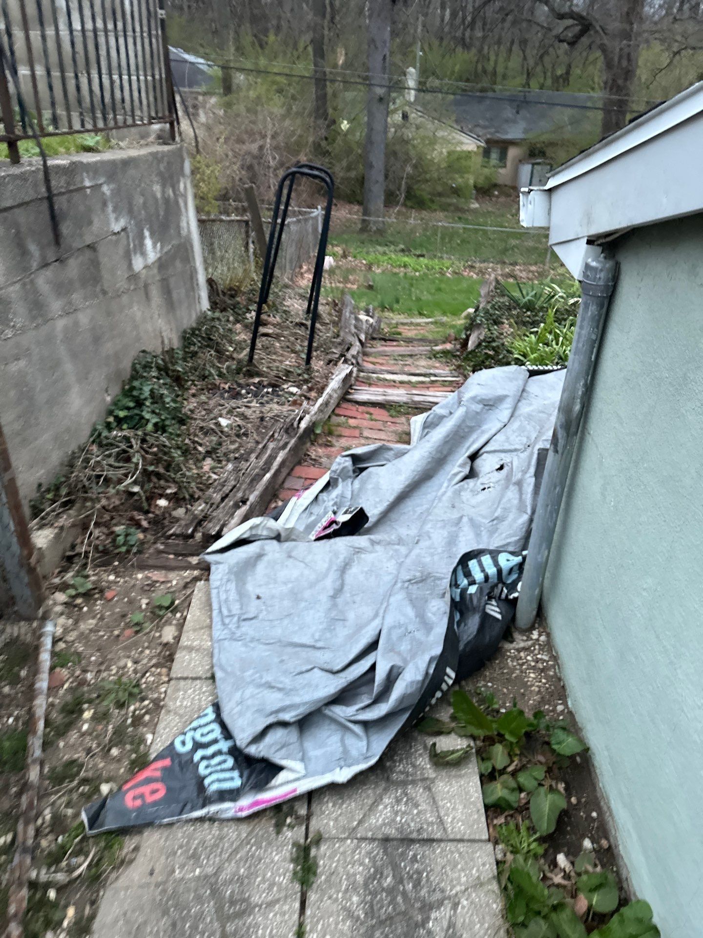 Tarp down the narrow side path