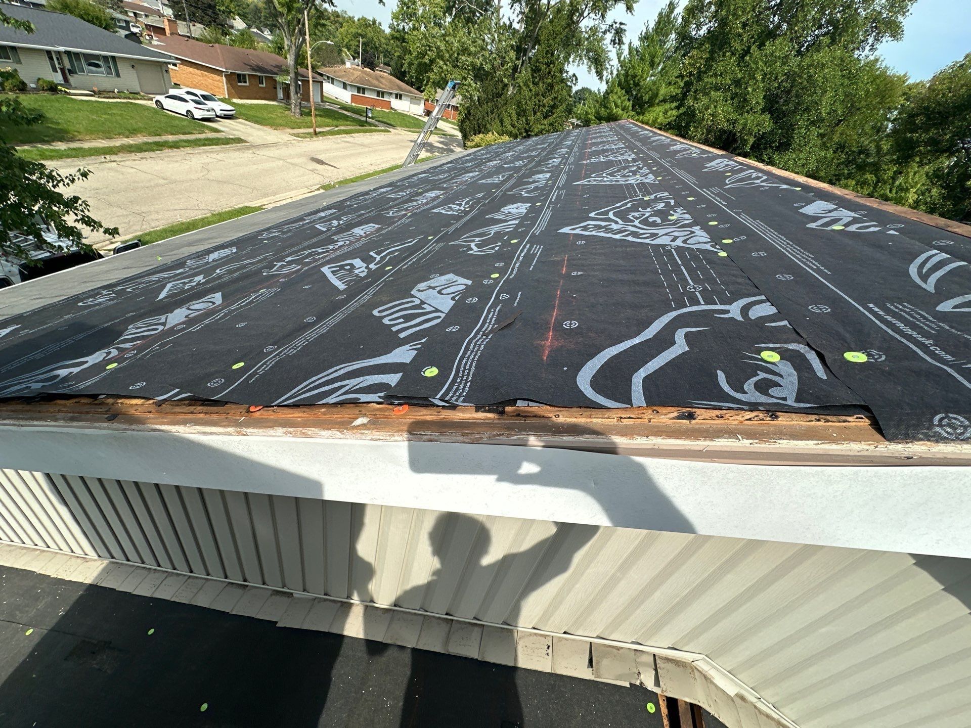 Synthetic underlayment over the roof, with the lower roof's edge below, Fairborn, Ohio.