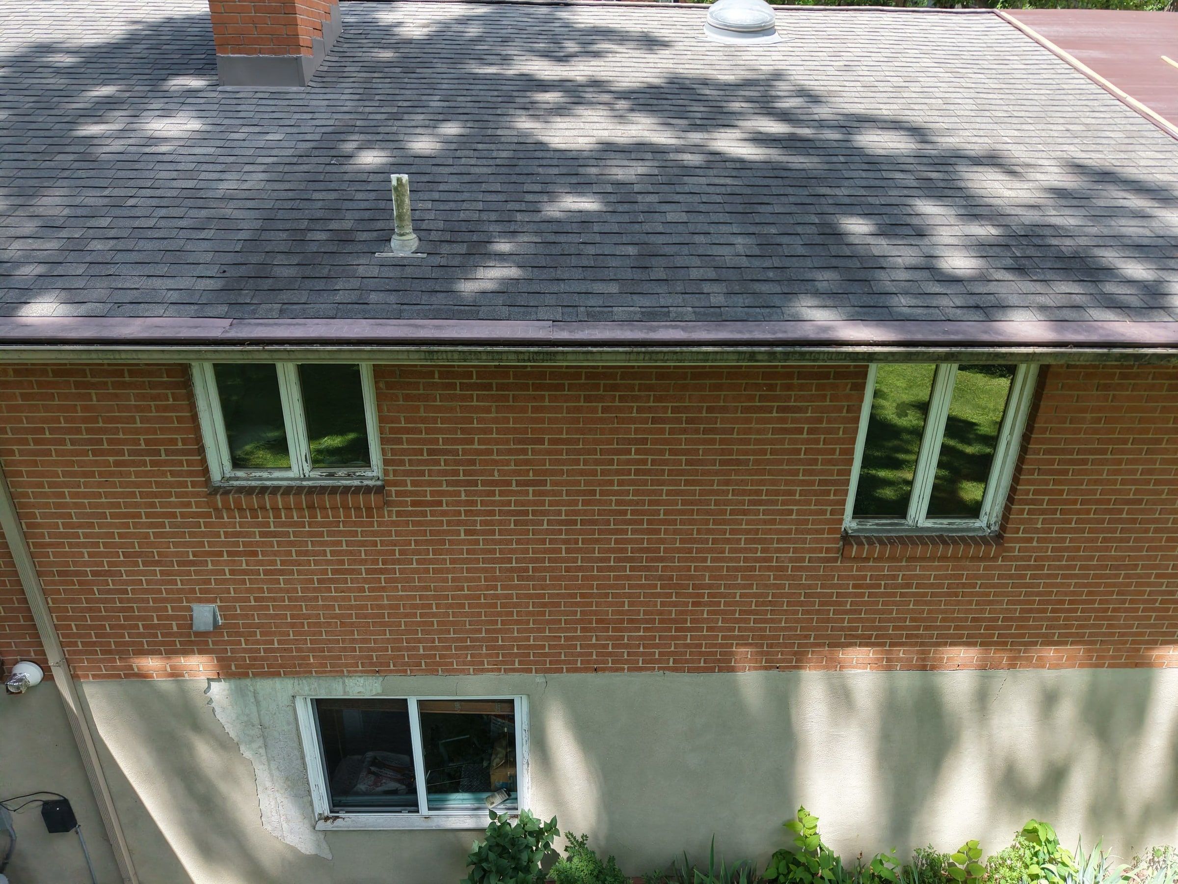 Rear of the brick house in tree shade