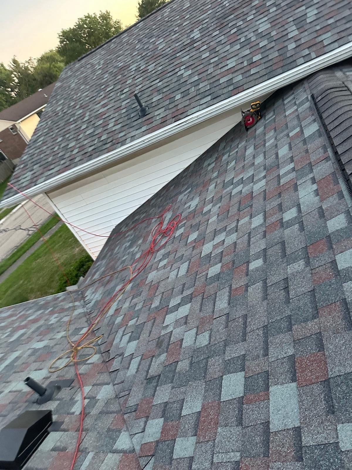Finished shingles in the valley where the lower roof meets the siding, West Carrollton, Ohio.
