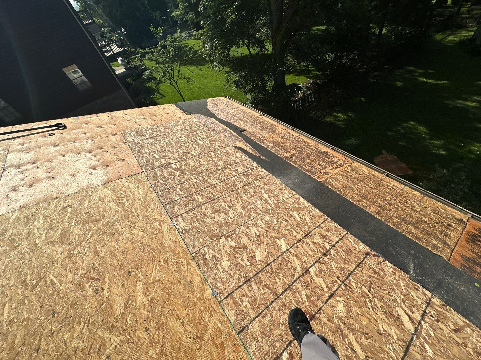 New OSB decking let into the old roof deck across the slope, Beavercreek, Ohio.