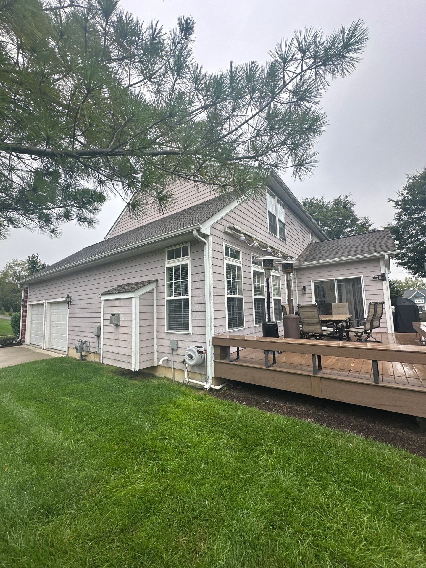 The back corner of the house above the deck, with the garage roof beyond, Beavercreek, Ohio.