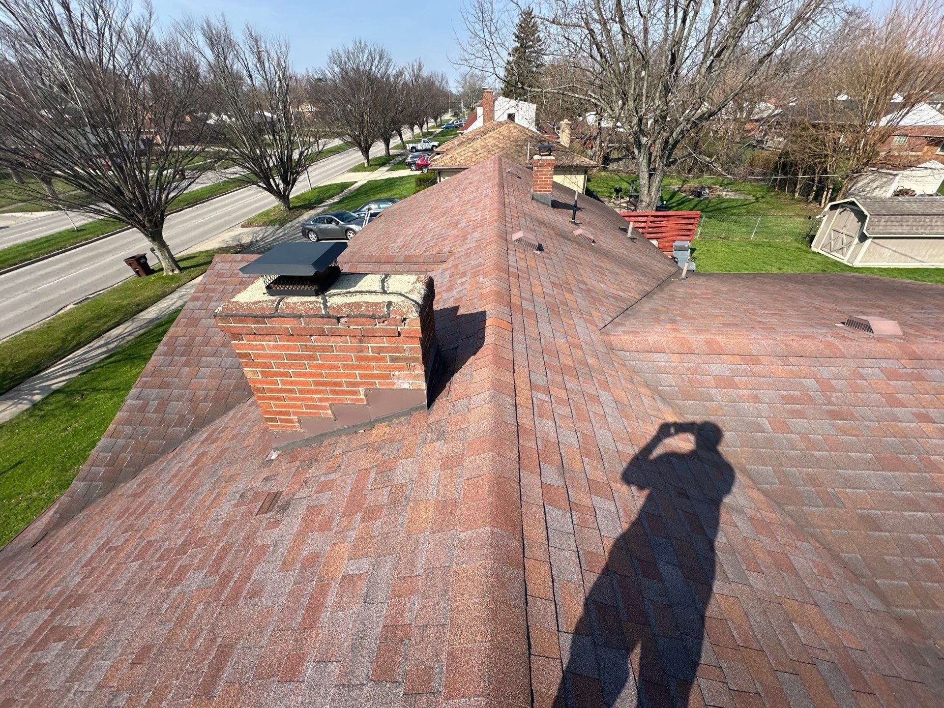 The roof and brick chimney above the street, Kettering, Ohio.