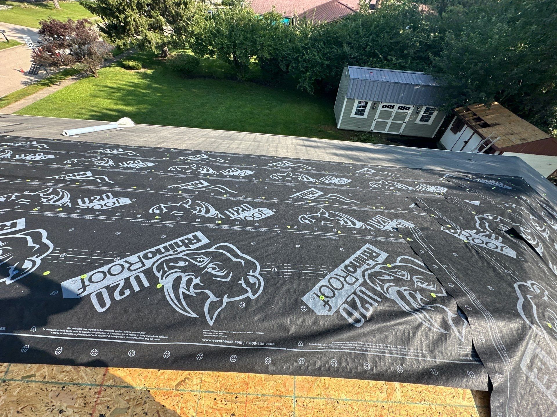 RhinoRoof synthetic underlayment over most of a slope, with the shed below, Dayton, Ohio.