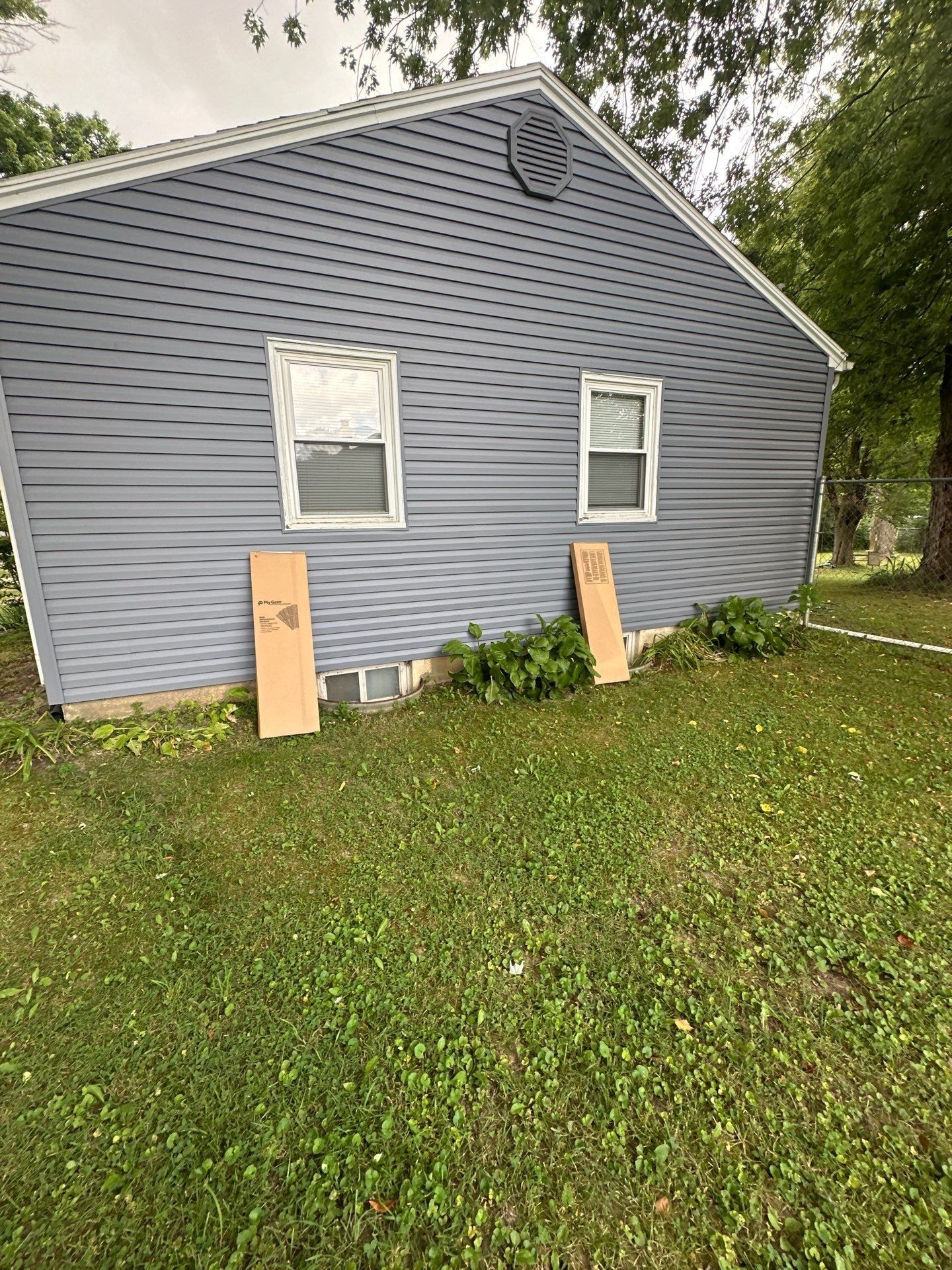 New shutters leaning against the gable end, waiting to go up, Beavercreek, Ohio.