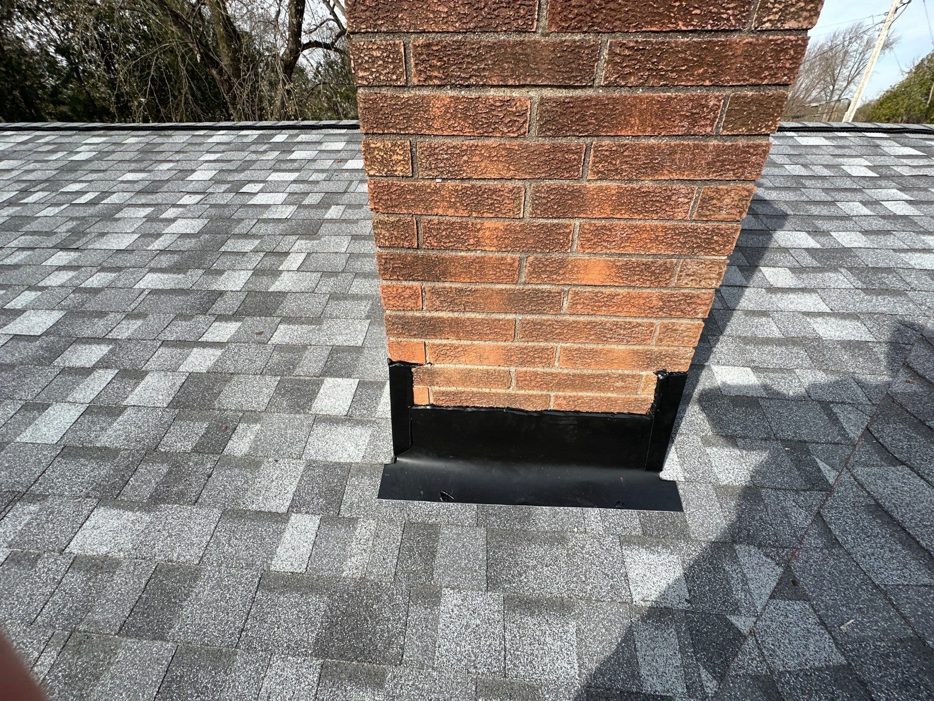 Brick chimney head-on and base flashing