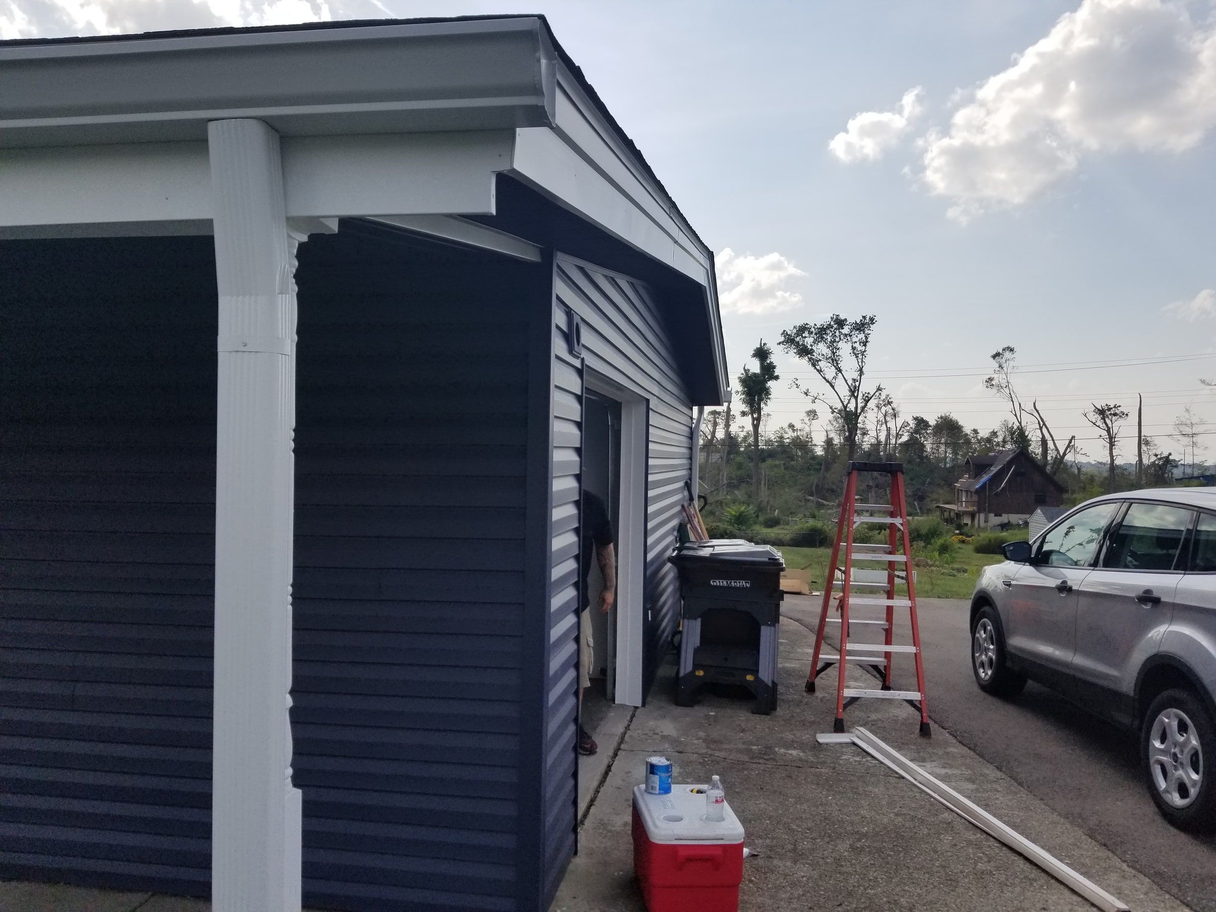 The porch corner and the garage in new blue siding, Beavercreek, Ohio.