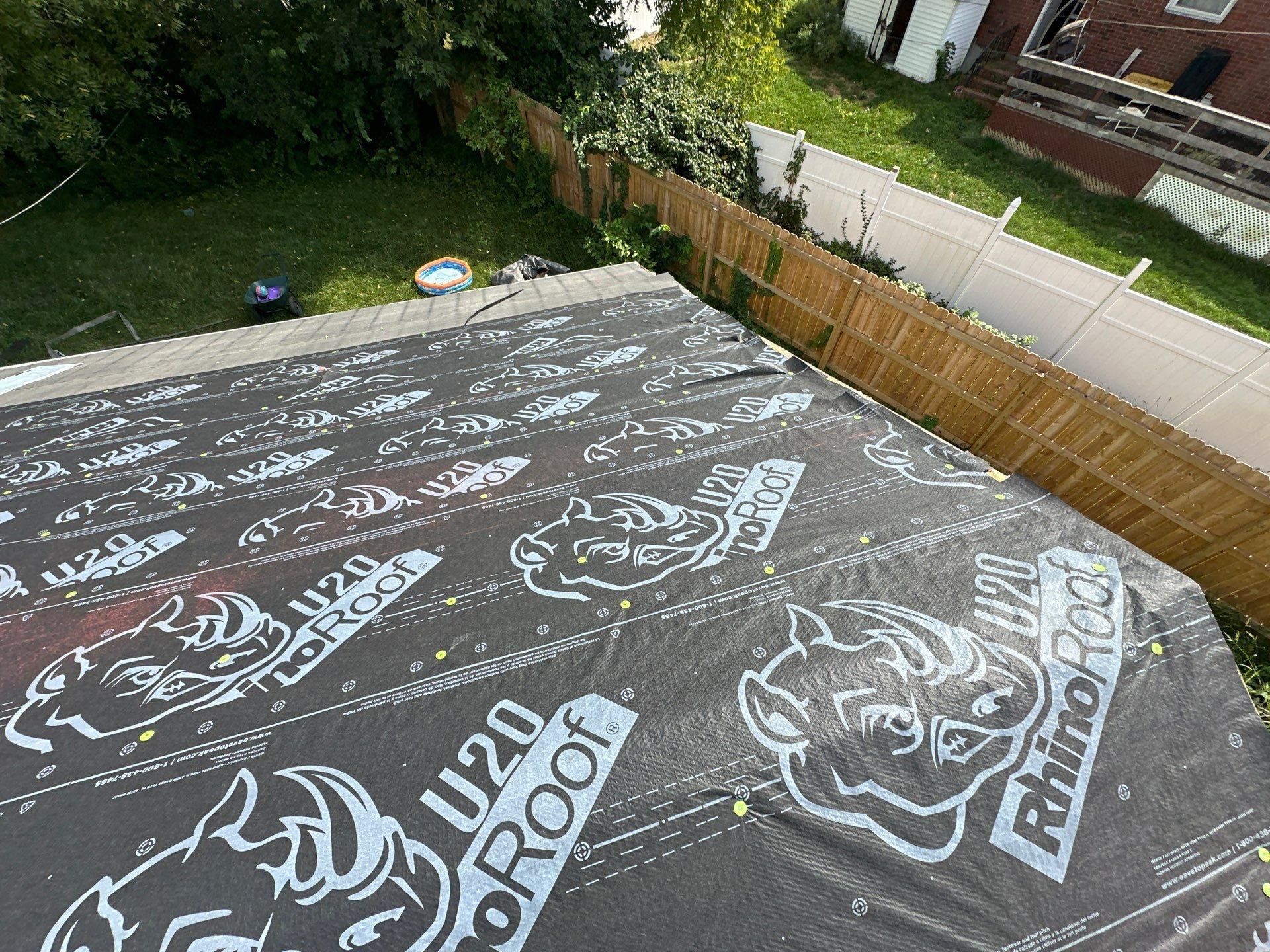 Overlapping courses of RhinoRoof underlayment above the back yard, Fairborn, Ohio.