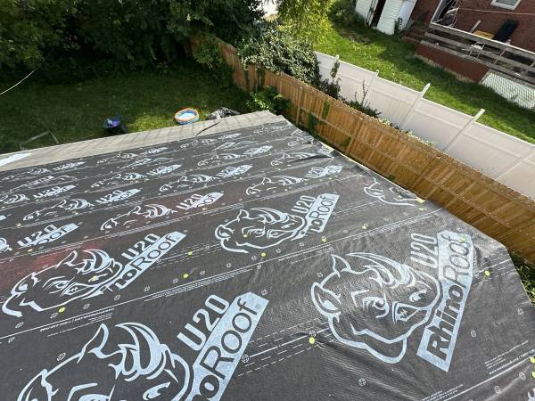 Overlapping courses of RhinoRoof underlayment above the back yard, Fairborn, Ohio.