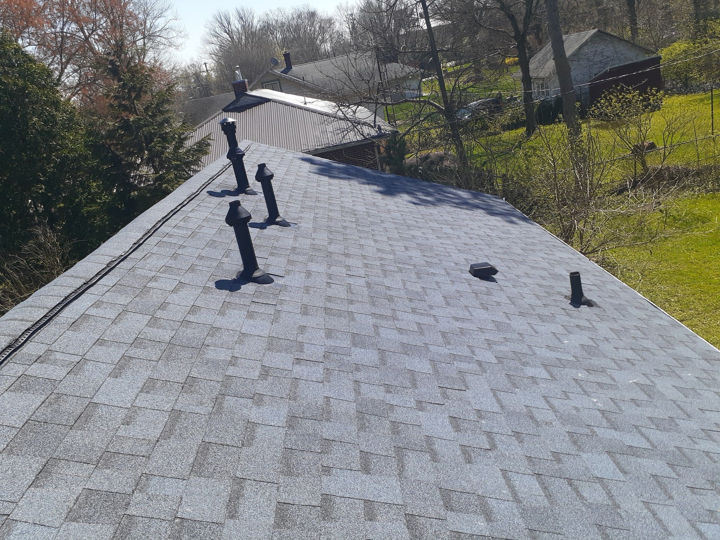 The finished back slope with its new pipe boots and roof vents, Yellow Springs, Ohio.