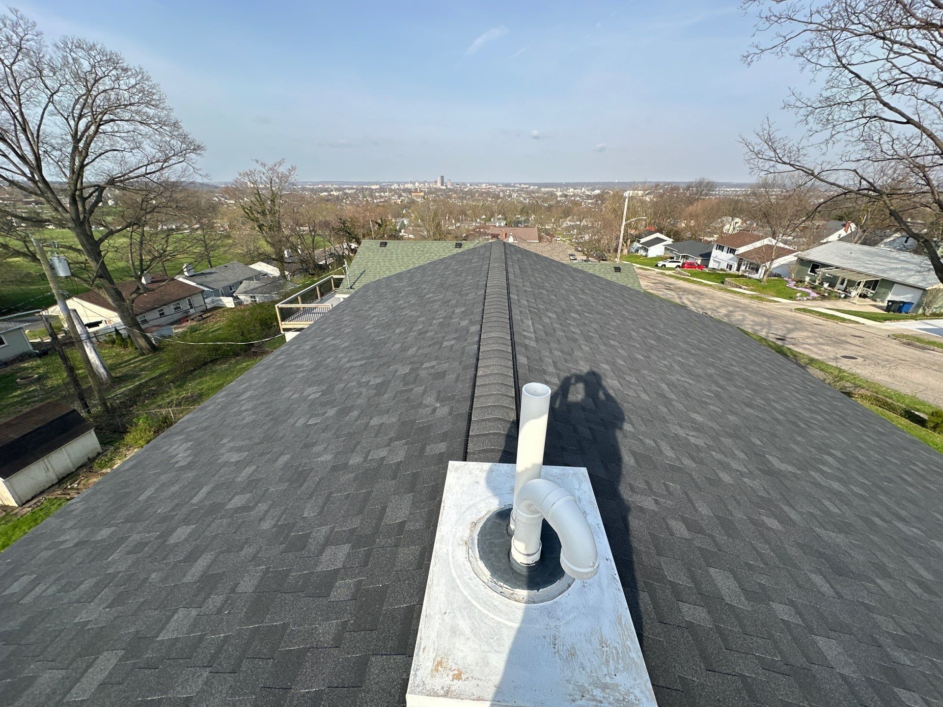 The finished roof and faux chimney with the city skyline beyond, Dayton, Ohio.