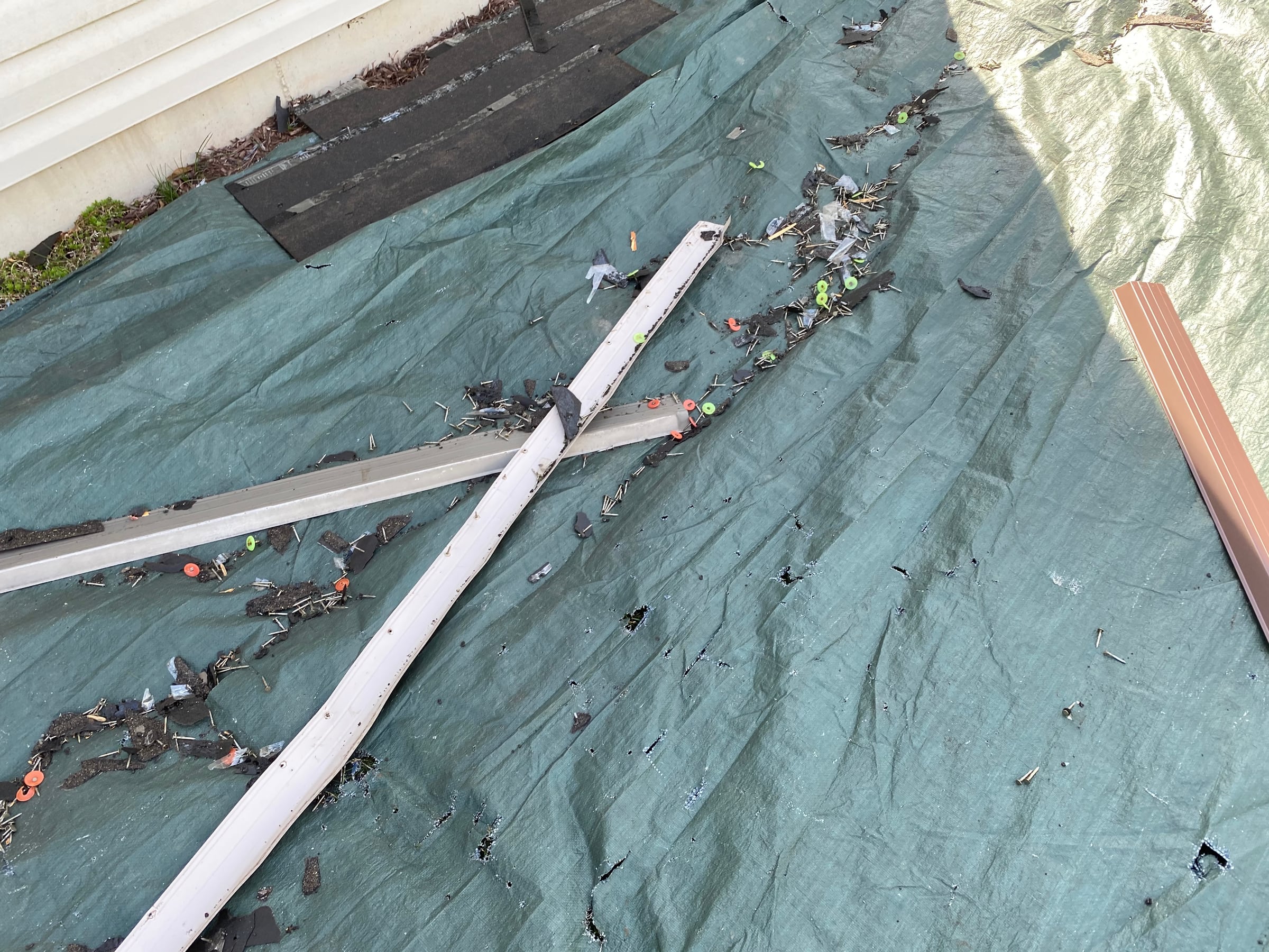 Old edge metal on a ground tarp