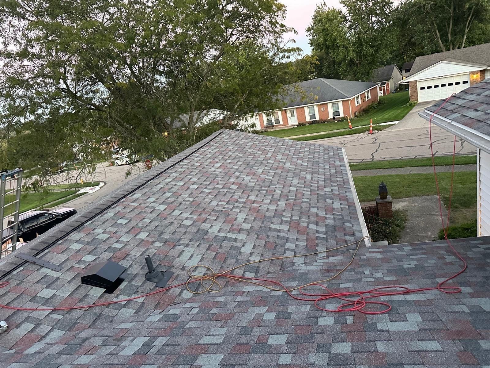 The finished wing roof with a new vent, above the street, West Carrollton, Ohio.