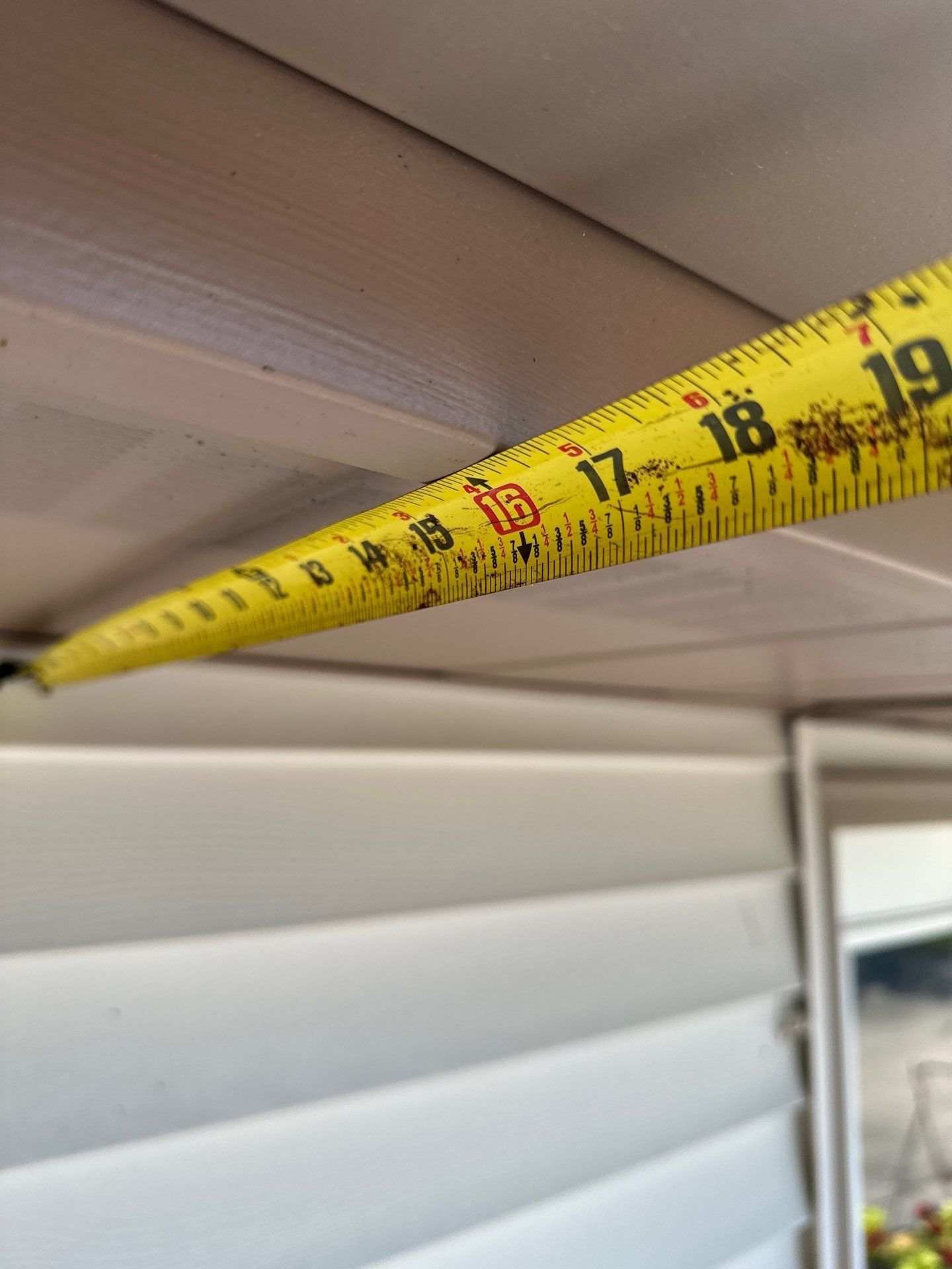A tape measure across the soffit of the building, Kettering, Ohio.