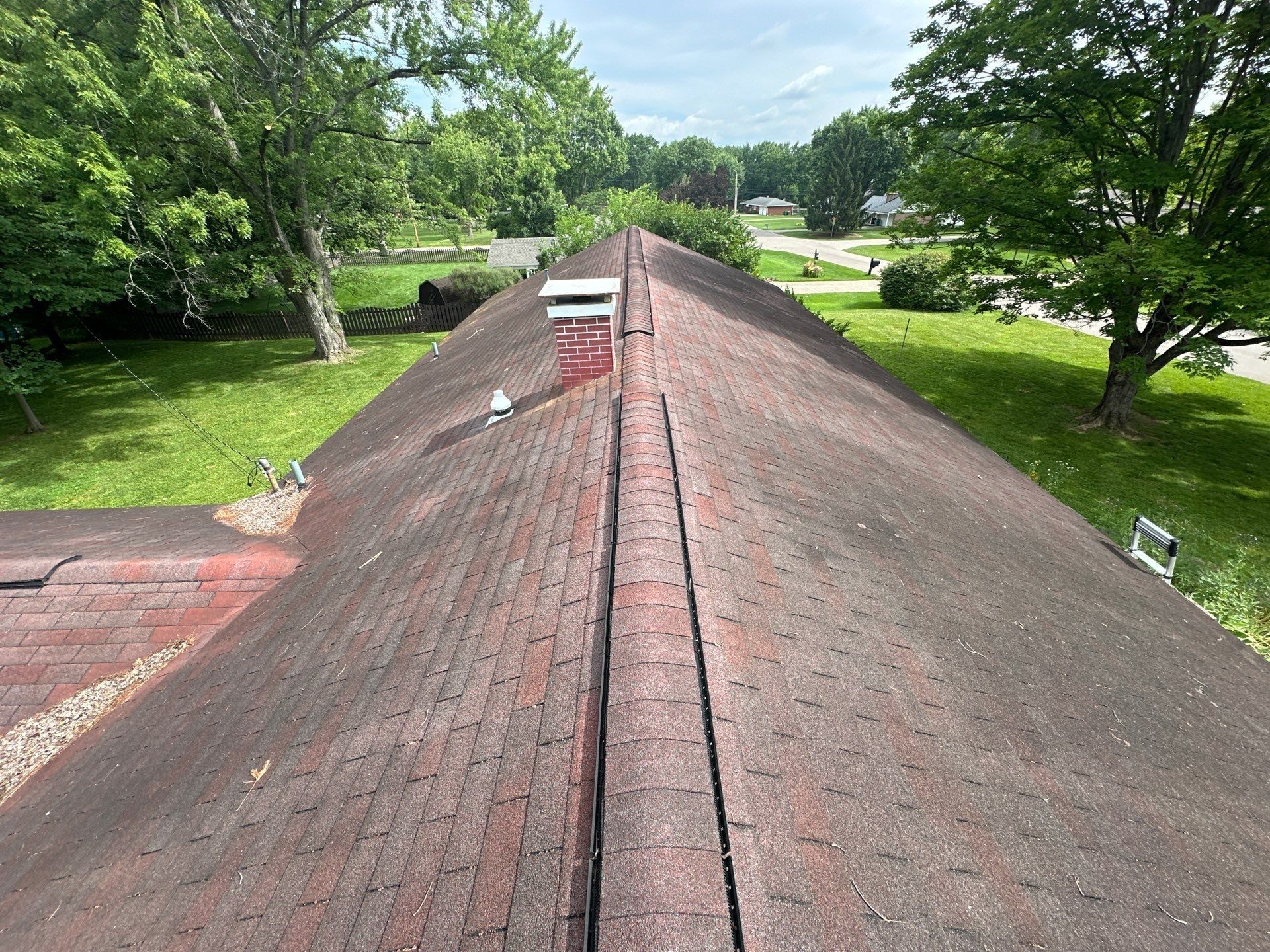 The old three-tab shingle roof along the ridge toward the chimney, Beavercreek, Ohio.