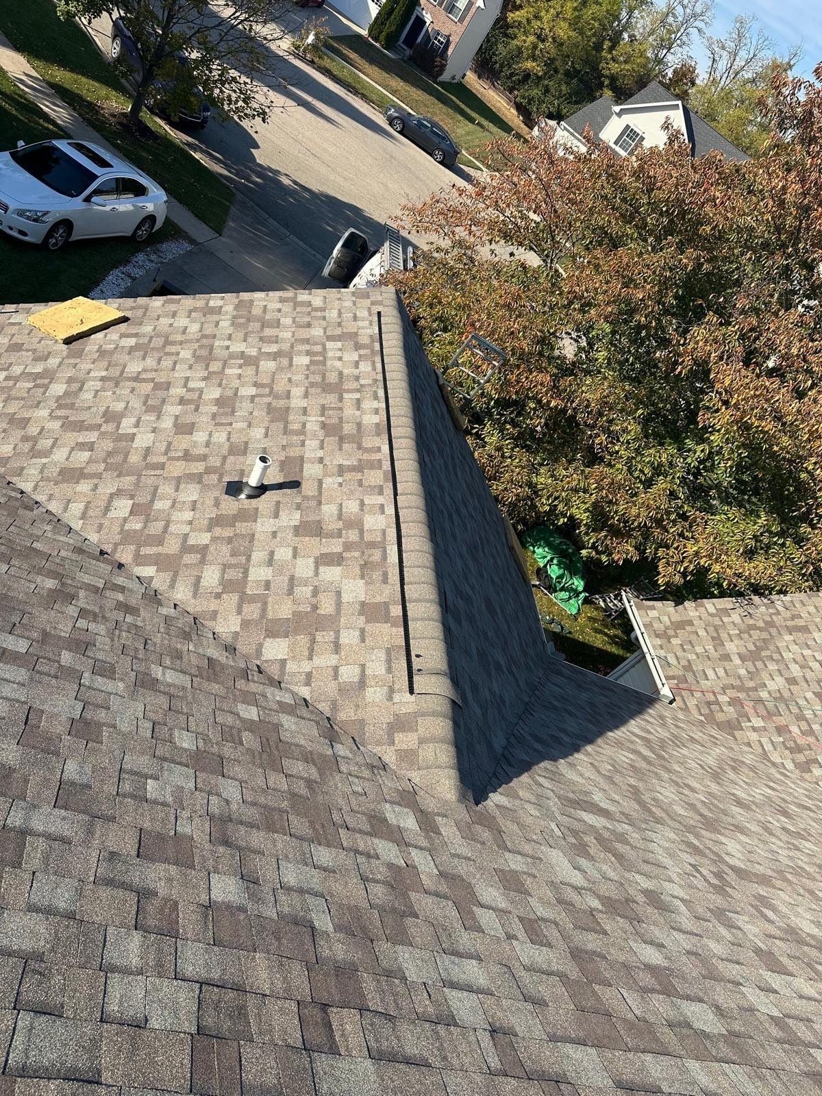A finished gable section with its new ridge cap, the street beyond, Beavercreek, Ohio.