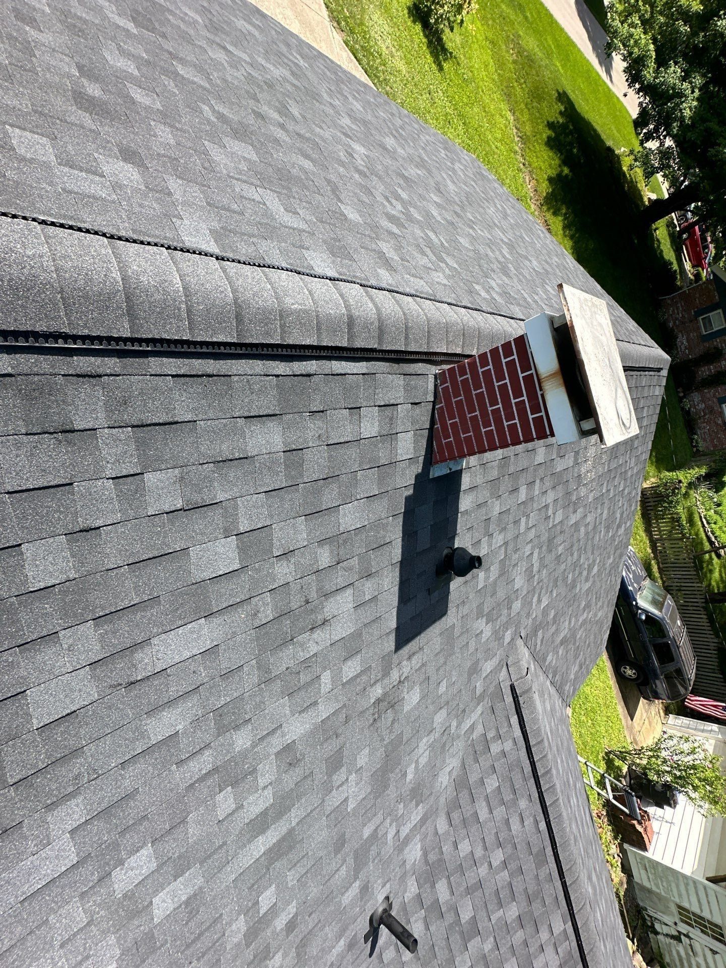 Brick chimney, metal cap and pan