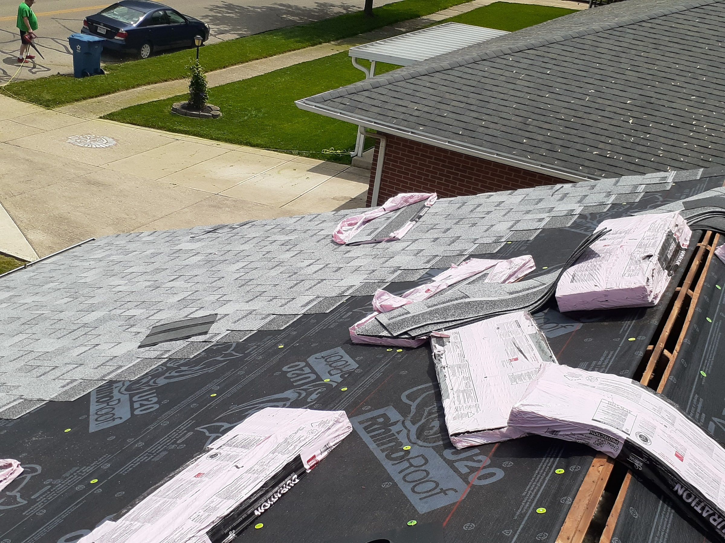 New shingles going on over the underlayment above the driveway, Huber Heights, Ohio.