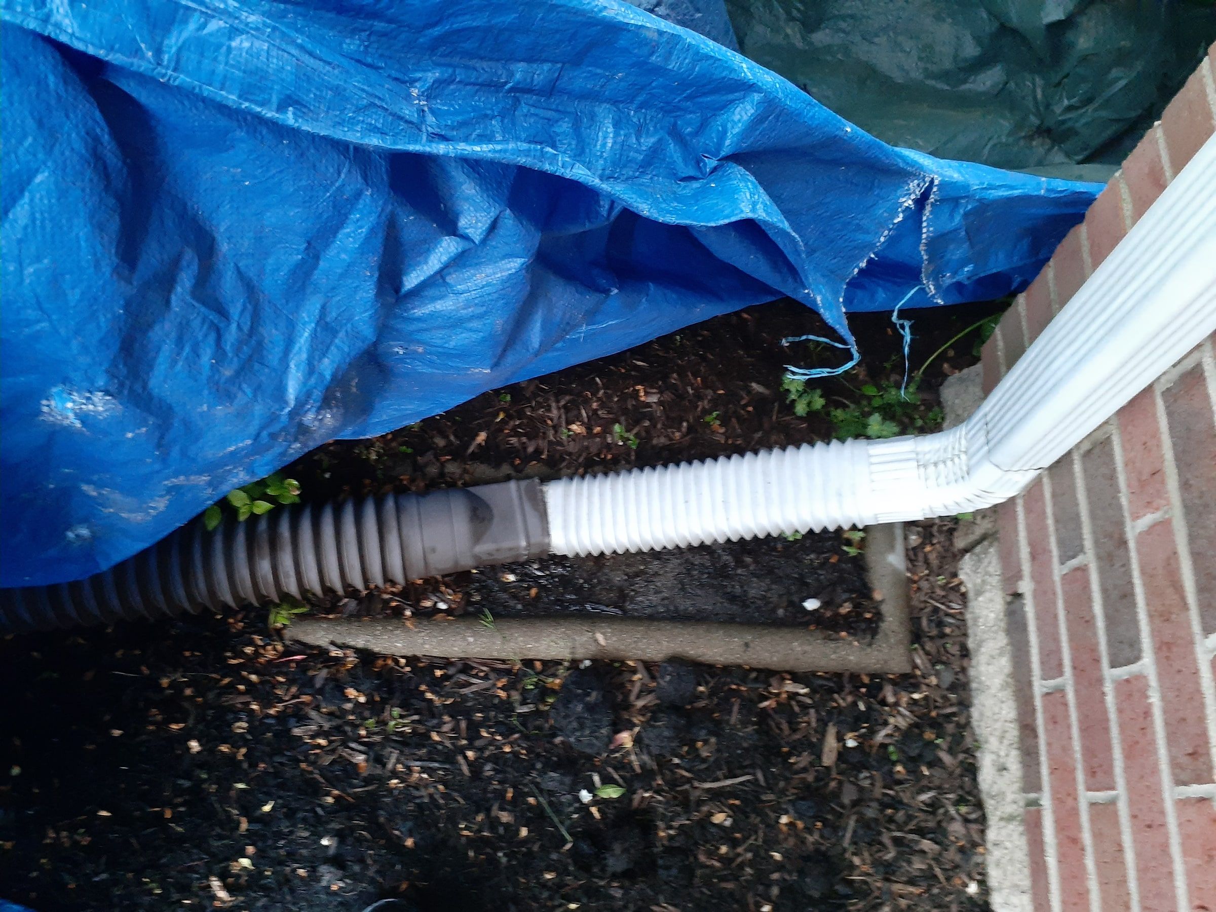 Ground tarp and the downspout drain extension