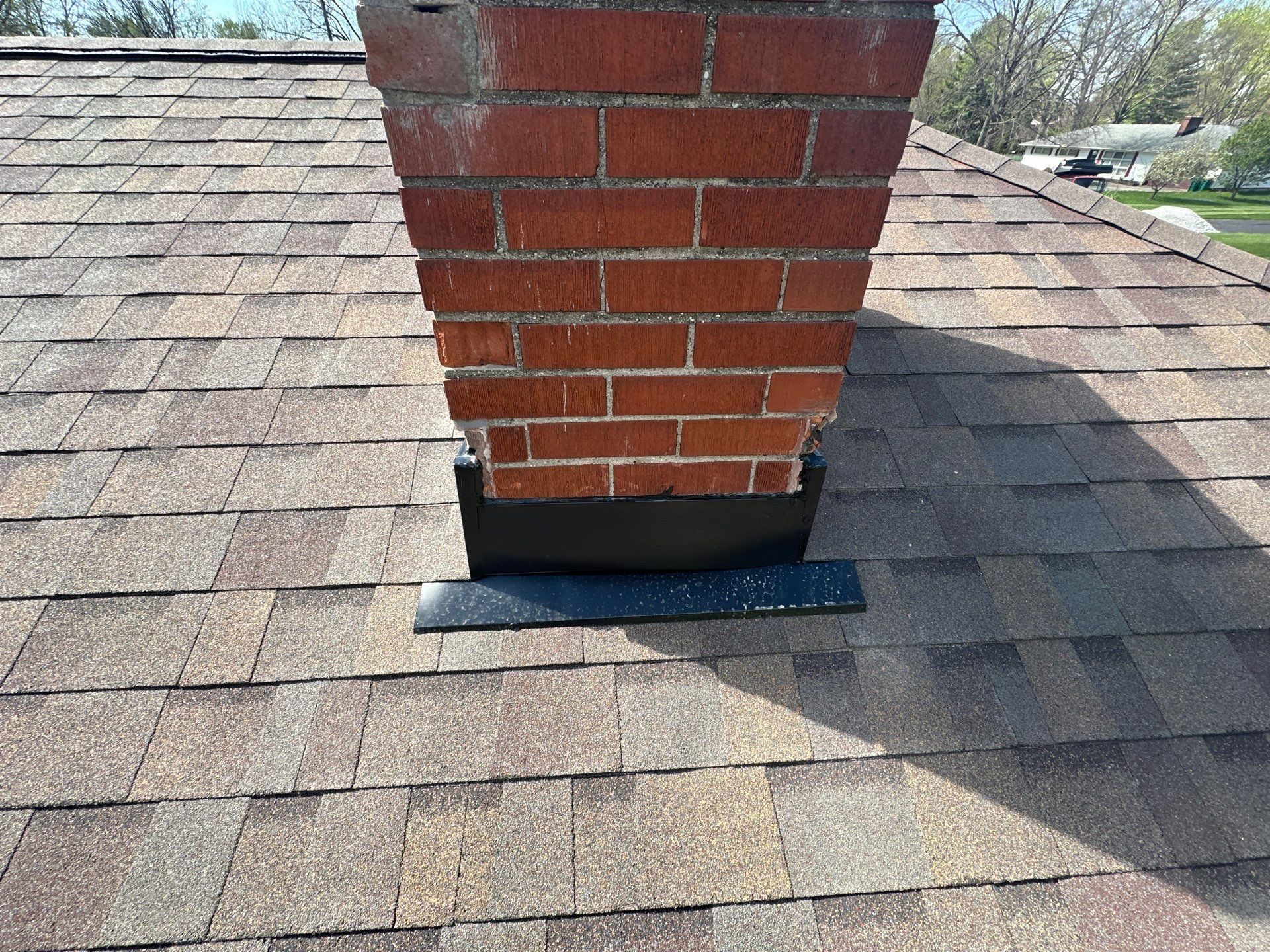New flashing across the low side of the chimney, Beavercreek, Ohio.