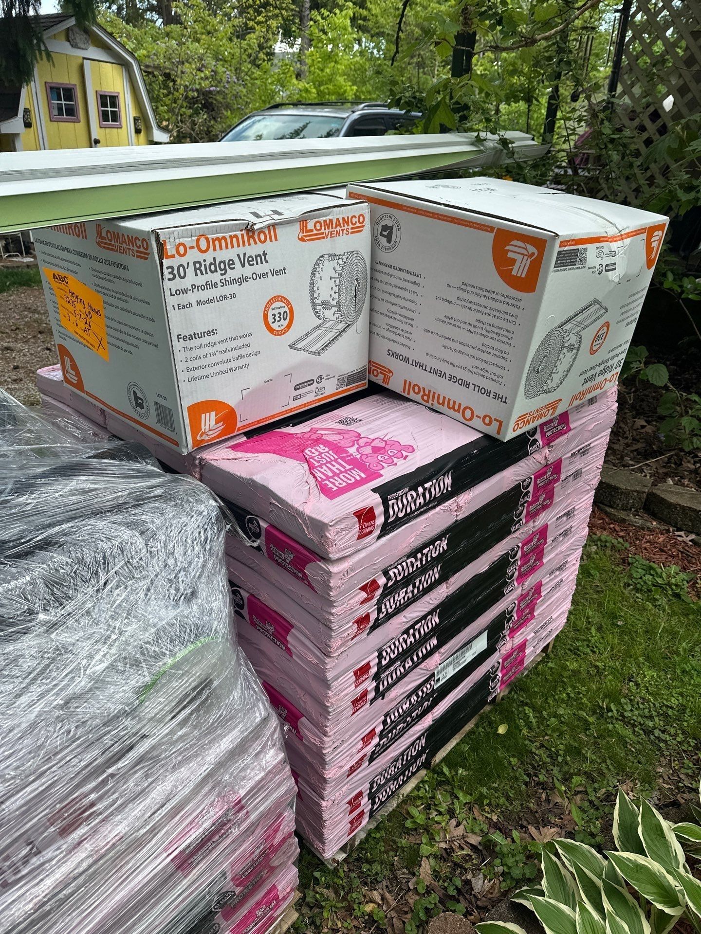 Owens Corning Duration bundles and ridge vent boxes delivered beside the house, Springfield, Ohio.