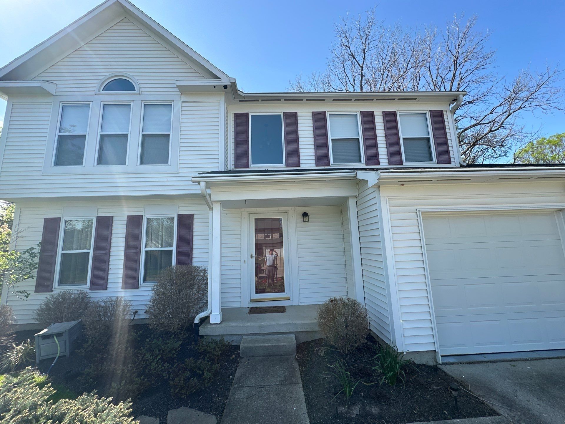 Front entry, porch and arched gable window