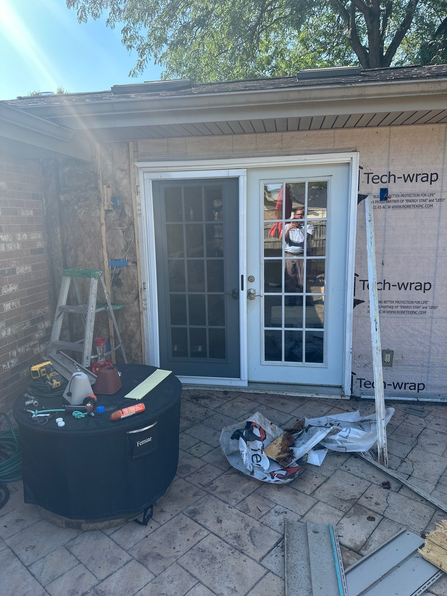 The sunroom's back door with house wrap around it, Beavercreek, Ohio.