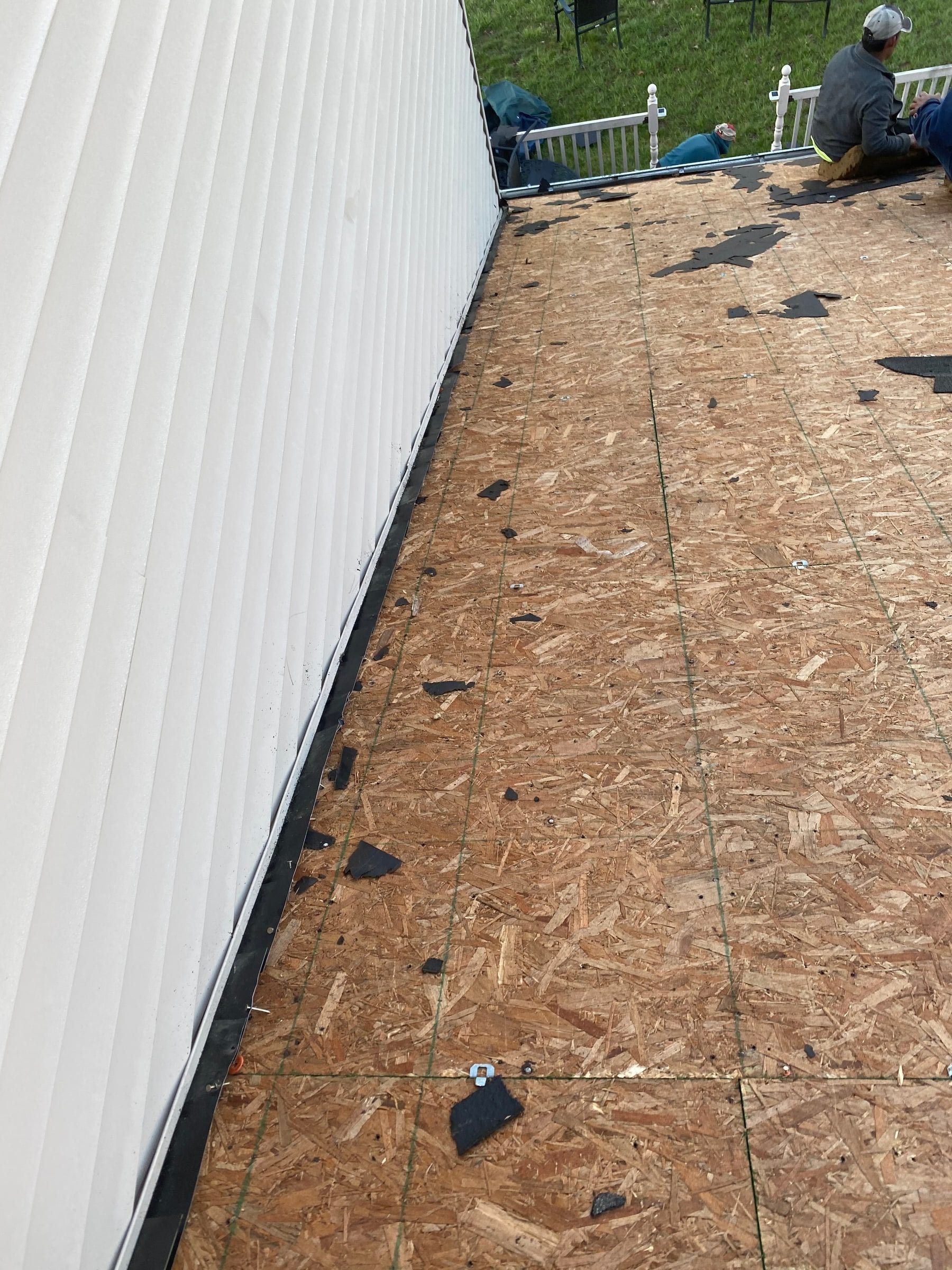 Stripped deck, chalk lines and shingle scraps