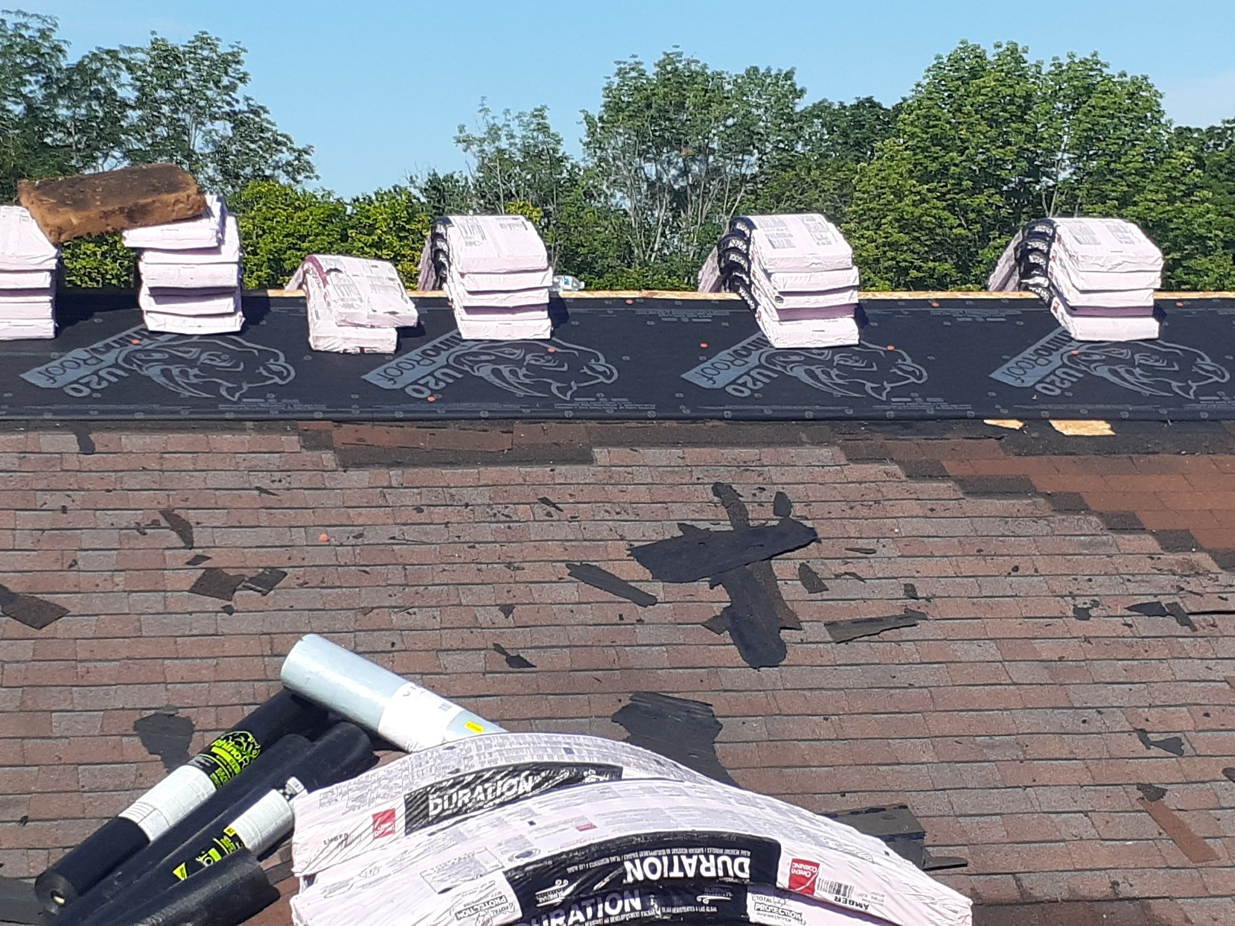 Owens Corning Duration bundles staged at the ridge above the old shingles, Jamestown, Ohio.