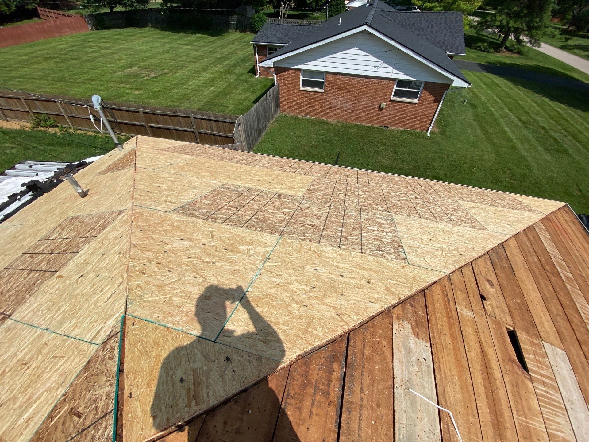 Freshly sheathed hip next to plank deck still waiting to be covered, Beavercreek, Ohio.