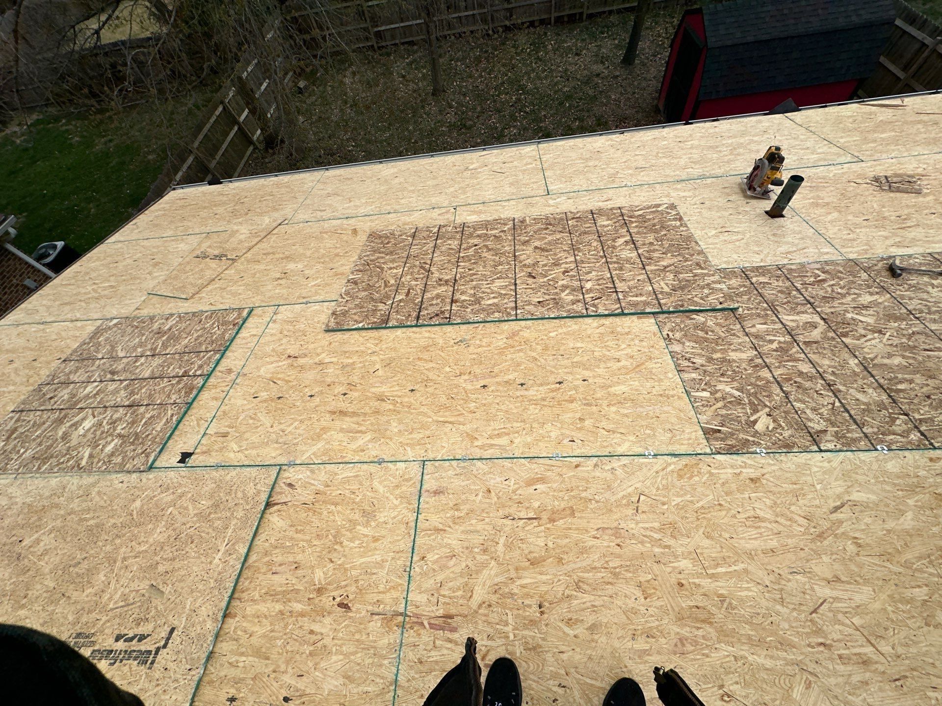 New OSB sheathing patched into the roof deck, looking down the slope, Dayton, Ohio.